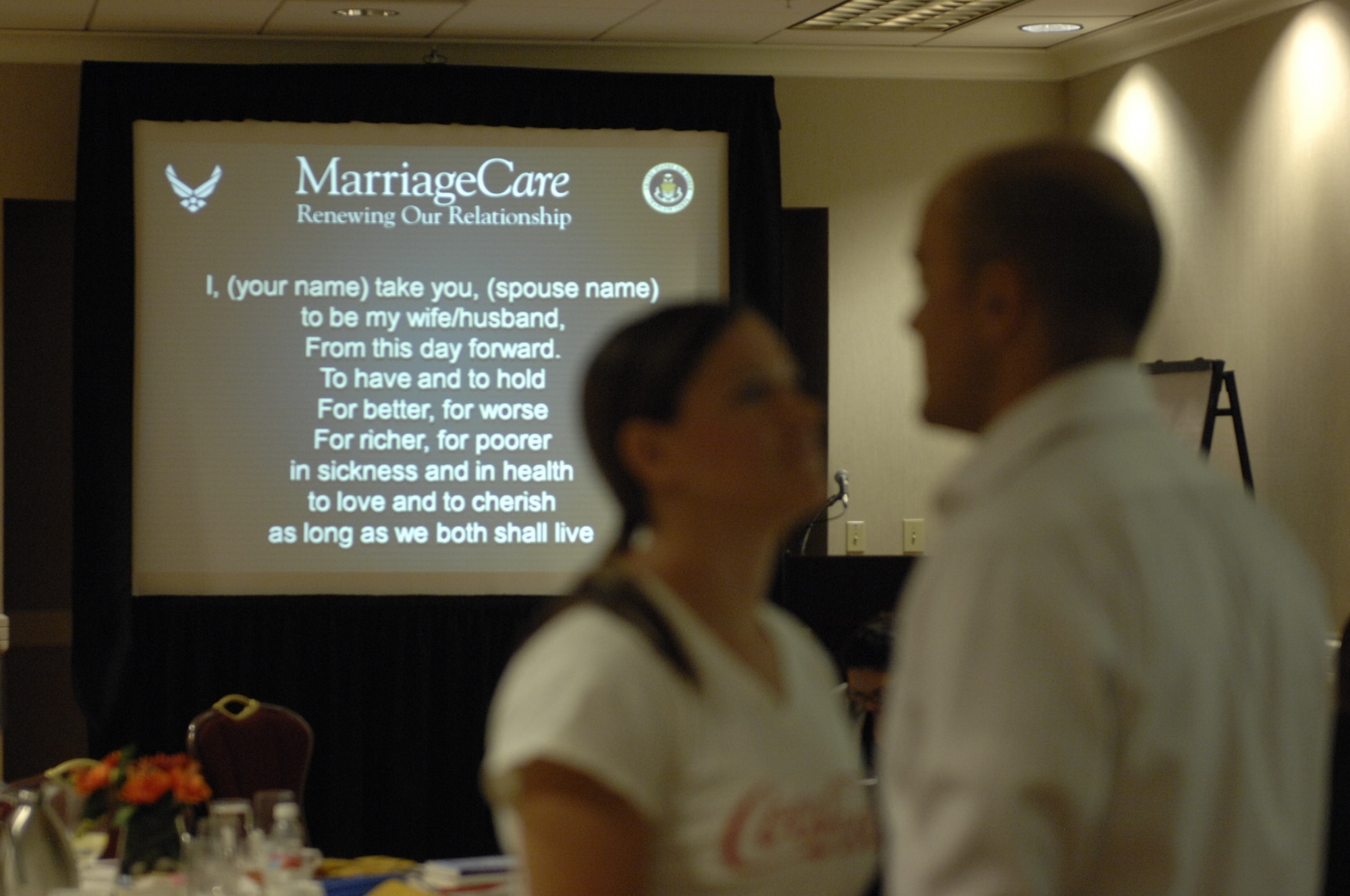 Capt. Spencer Crandall, currently assigned to U.S. Air Forces Central, and his wife Kristen say their vows to each other again during a marriage retreat in Charlotte, N.C., Sept. 23, 2012. During the three day retreat, the chaplain who led the event broke down the meaning of different lines of their vows and what those lines meant to each other. (U.S. Air Force photo by Airman 1st Class Krystal M. Jeffers/Released)