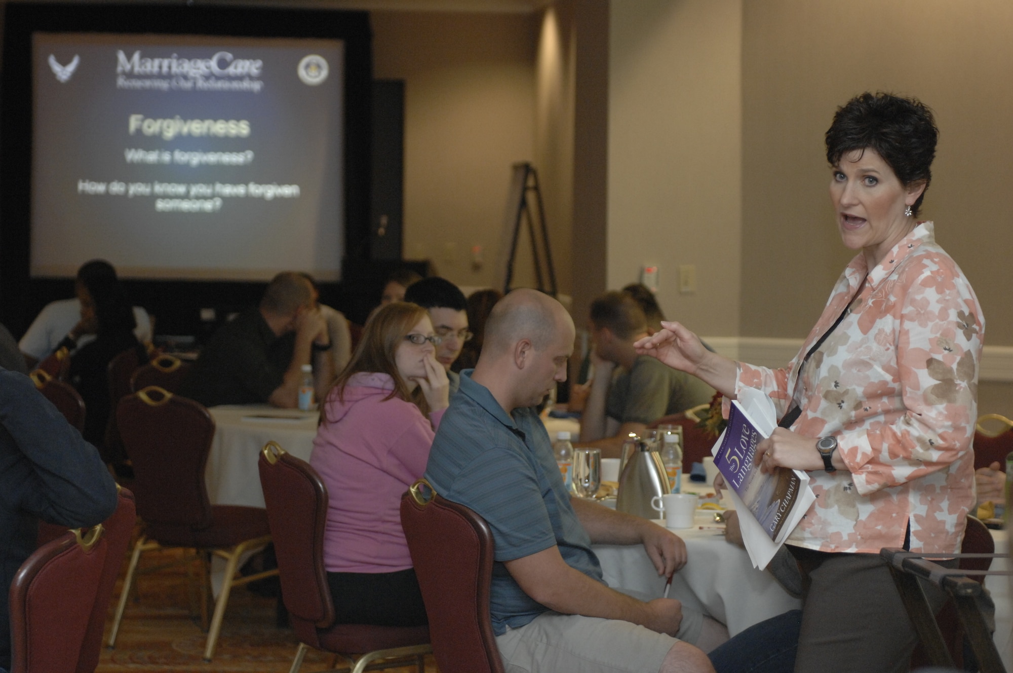 Capt. Kathy Scott, 20th Fighter Wing chaplain, leads a class on forgiveness during a marriage retreat in Charlotte, N.C., Sept. 23, 2012. She gave the couples the book “The 5 Love Languages of Apology” by Gary Chapman and Jennifer Thomas to help teach them how there are different ways to apologize. She also taught them that each person has a specific one that means the most to them and would seem the most sincere. (U.S. Air Force photo by Airman 1st Class Krystal M. Jeffers/Released)