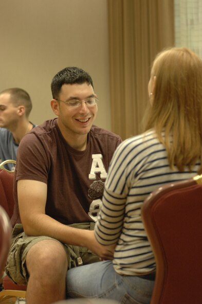 Staff Sgt. Jason Andule, 20th Component Maintenance Squadron electronic warfare team leader, tells his wife, Jessica, the attributes he loves about her during a marriage retreat in Charlotte, N.C., Sept. 23, 2012. The retreat focused on refreshing and renewing the couples’ love and having them learn more about each other.  (U.S. Air Force photo by Airman 1st Class Krystal M. Jeffers/Released)