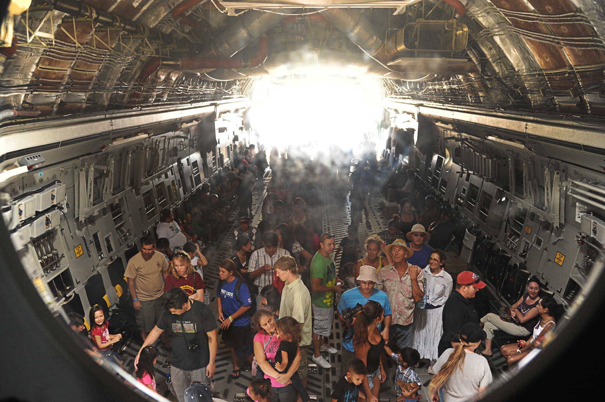 Aviation enthusiasts tour a static C-17 Globemaster III at the 2012 Kaneohe Bay Air Show at Marine Corps Base Hawaii, Sept. 29. The aircraft was showcased to more than 100-thousand spectators, both in the air and on the ground, over the course of the weekend. (U.S. Air Force photo/Senior Airman Lauren Main)