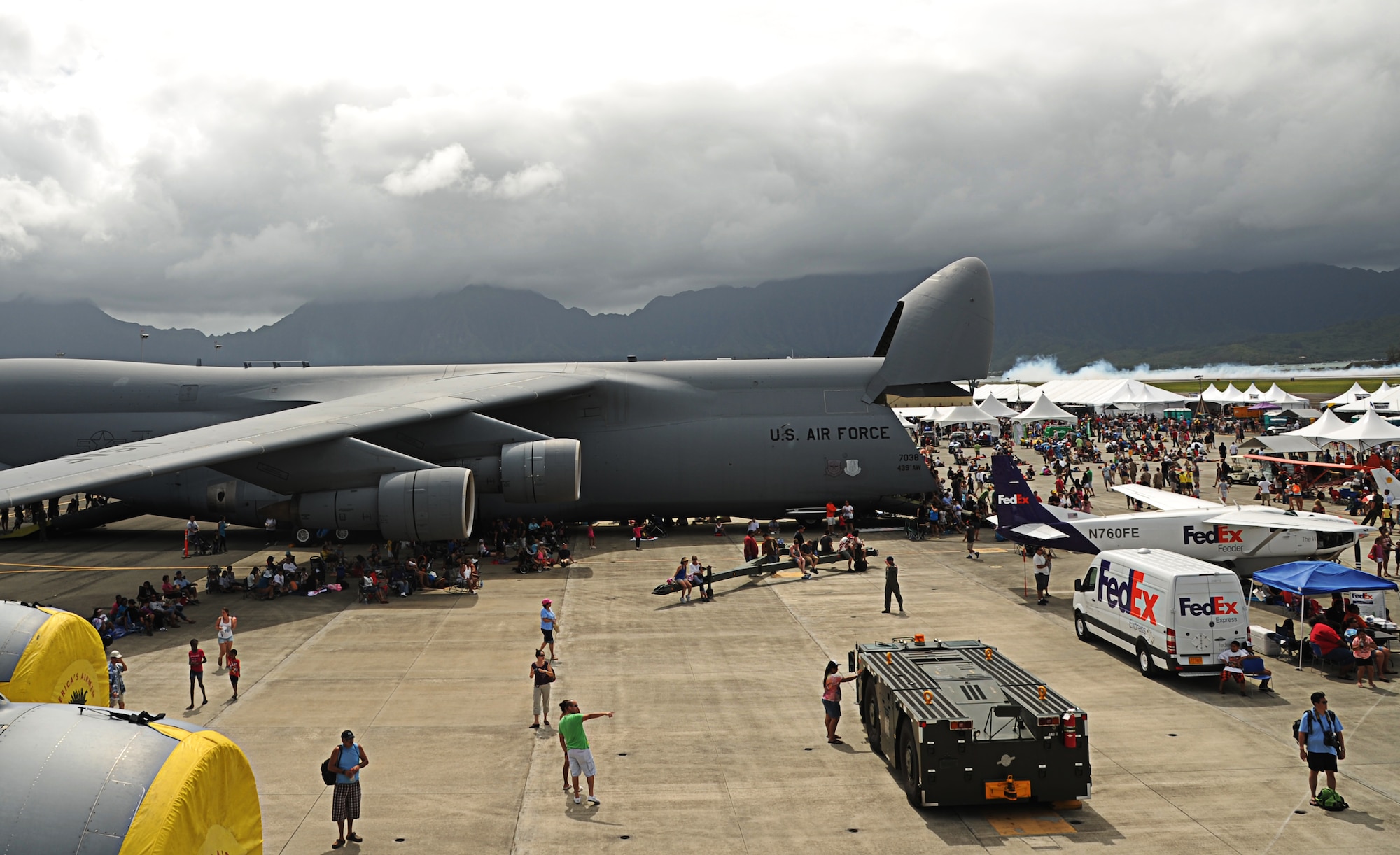 Aviation enthusiasts visit static aircraft at the 2012 Kaneohe Bay Air Show at Marine Corps Base Hawaii, Sept. 29. Amongst the statics was a C-17 Globemaster III assigned to the 535th Airlift Squadron, Joint Base Pearl Harbor-Hickam, Hawaii (yellow engine covers). (U.S. Air Force photo/Senior Airman Lauren Main)