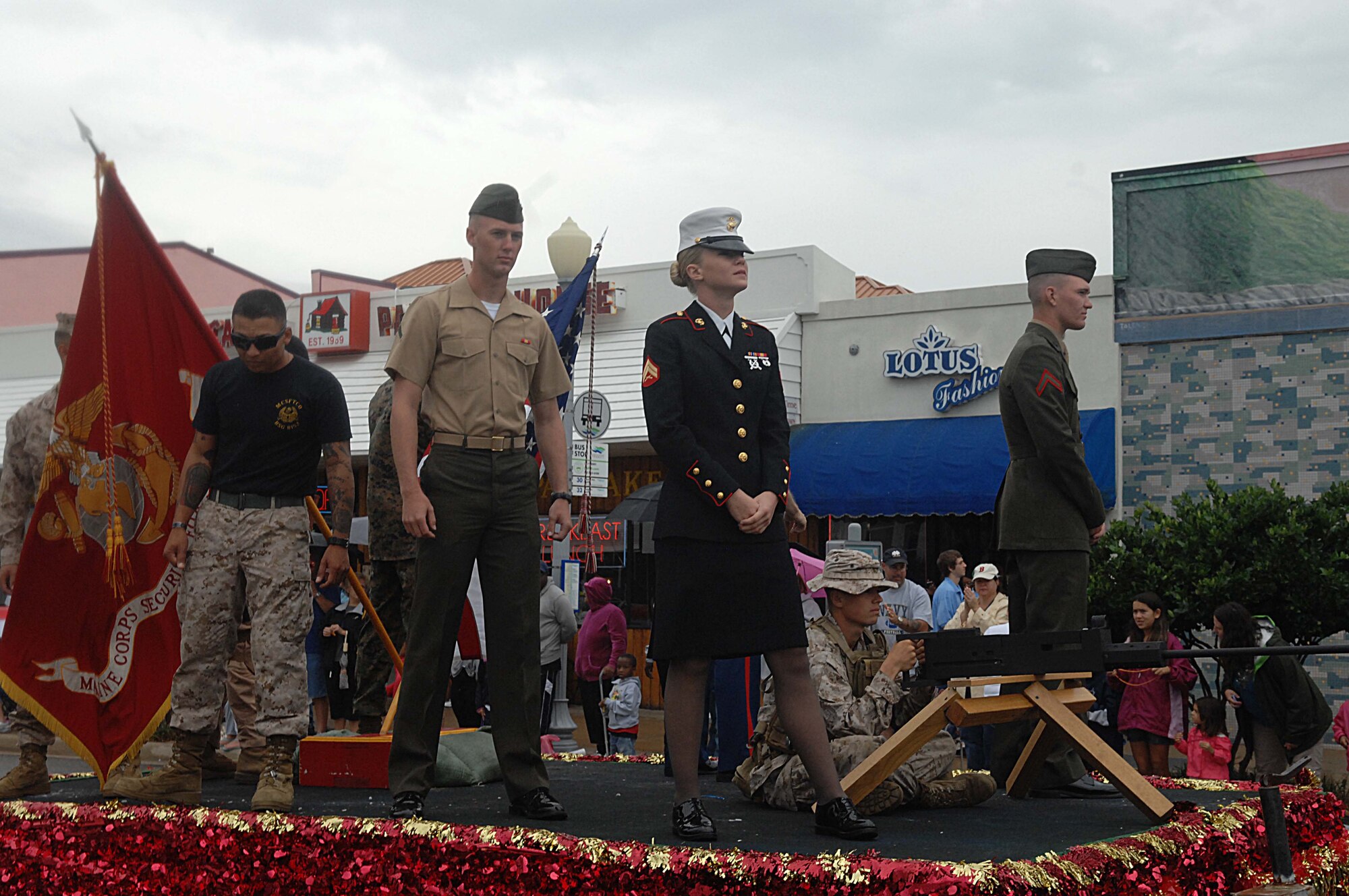 A float of silent, still Marines passes during the Neptune Festival Grand Parade Sept. 29, 2012, at Virginia Beach, Va. Their statuesque poses exemplified the stalwart, unmovable presence of the U.S. Marine Corps. (U.S. Air Force photo by Airman 1st Class Austin Harvill/Released)