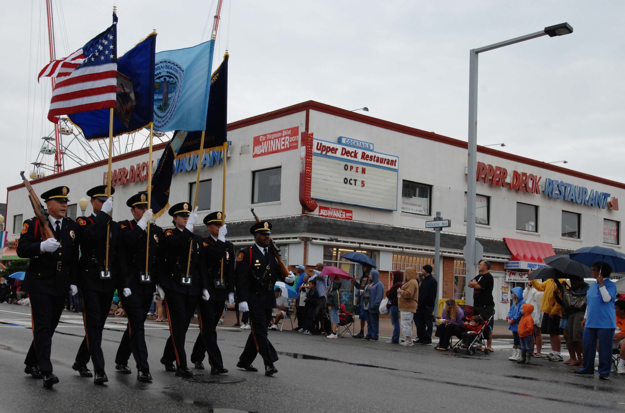 A U.S. Marine Corps color guard marches in the Neptune Festival Grand Parade Sept. 29, 2012, at Virginia Beach, Va. Many participants of the parade were military, which indicated the total force presence in the Hampton Roads community. (U.S. Air Force photo by Airman 1st Class Austin Harvill/Released)