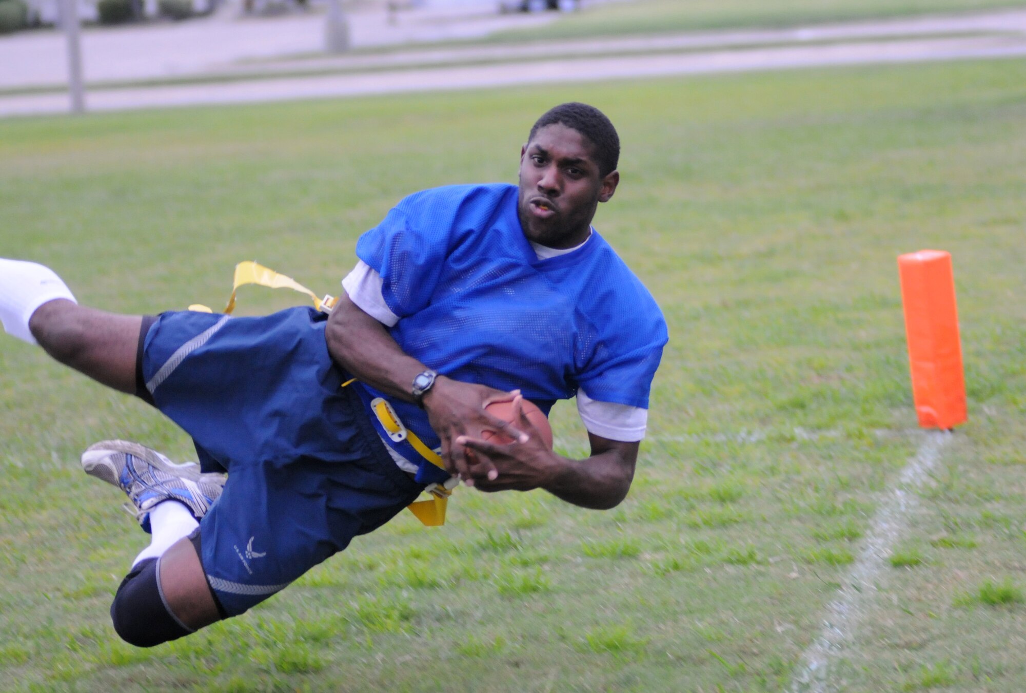 Michael McPherson, 334th Training Squadron, catches a pass in mid-air for a touchdown during an intramural flag football game Oct. 1, 2012, at Keesler Air Force Base, Miss.  (U.S. Air Force photo by Kemberly Groue)