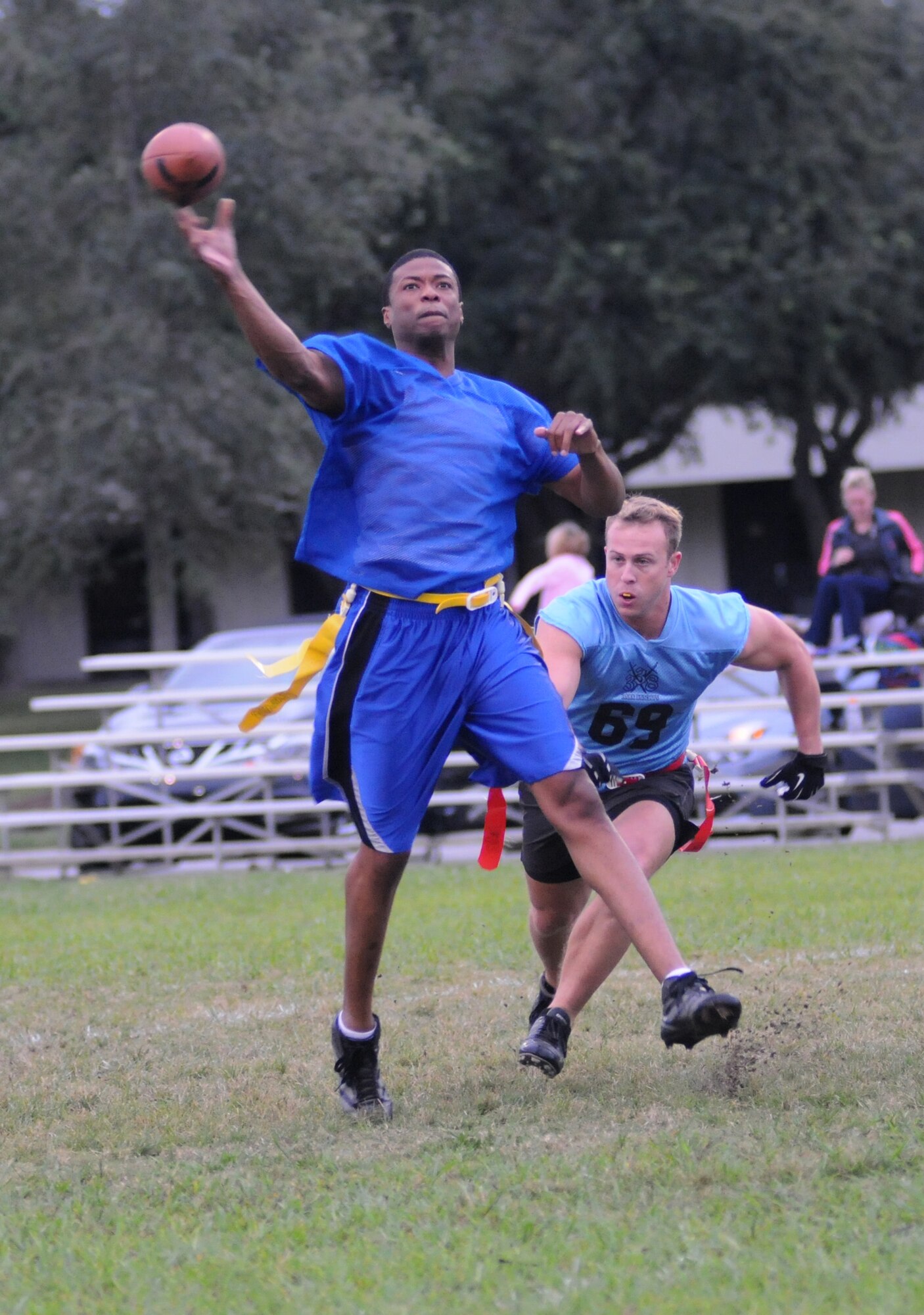 Dereck Lewis, 334th Training Squadron quarterback, makes a pass as Steven Teppeberg, 338th Training Squadron attempts to grab his flag during an intramural flag football game Oct. 1, 2012, at Keesler Air Force Base, Miss.  (U.S. Air Force photo by Kemberly Groue)