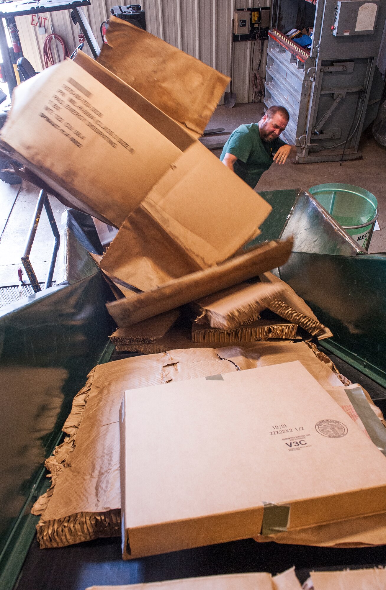 Gary Erwin, a recycling specialist at the base recycling center, loads cardboard onto a bailer, Sept. 28, 2012 at Little Rock Air Force Base, Ark. The recycling center is one of many contracts that must be paid by the 19th Civil Engineering Squadron.  (U.S. Air Force photo by Staff Sgt. Russ Scalf)