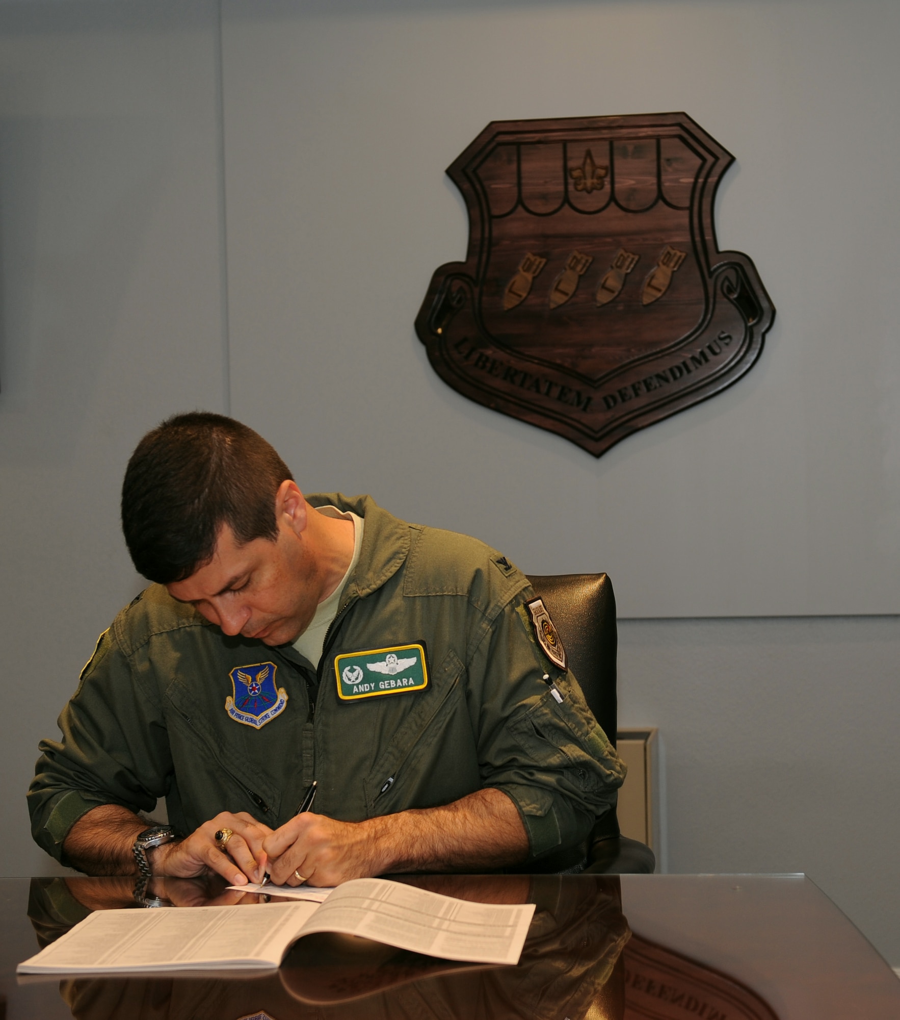 Col. Andrew Gebara, 2nd Bomb Wing commander, fills out a form for the Combined Federal Campaign on Barksdale Air Force Base, La., Sept. 28. The CFC is the world's largest charity workplace campaign. The CFC is a voluntary program that is employee-focused, cost efficient and effective in providing all Federal employees the opportunity to improve quality-of-life for all. The campaign began Sept. 26 and ends Nov. 7. (U.S. Air Force photo/Airman 1st Class Benjamin Gonsier)(RELEASED)
