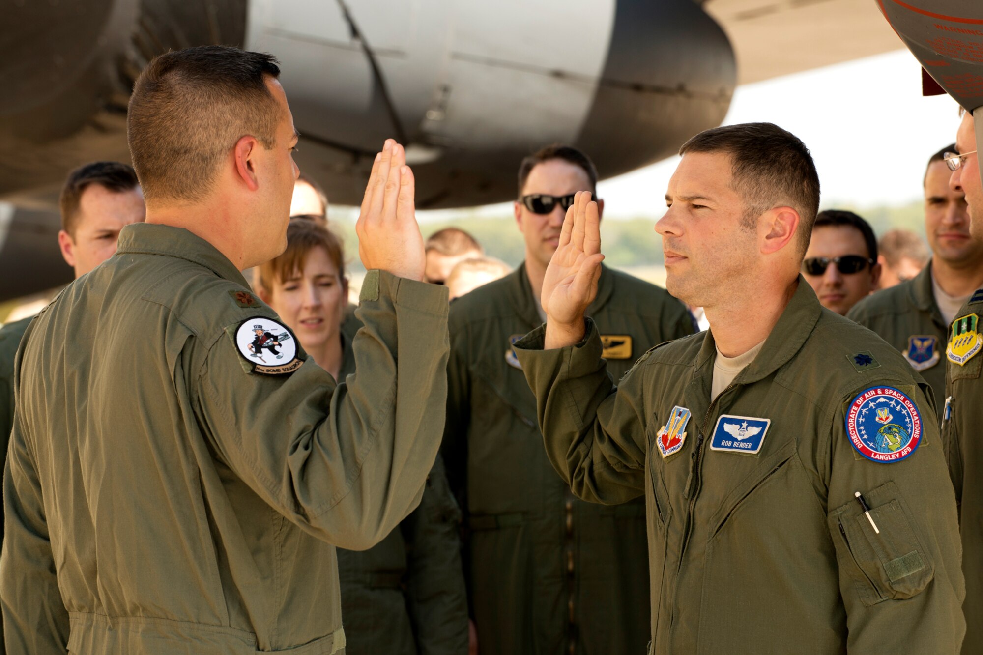 U.S. Air Force Maj. Brian Heck (left) recites the oath during a Pinning On ceremony, Sept. 28, 2012, Barksdale Air Force Base, La. Lt. Col. Robert Bender officiated the ceremony, which was held in front of a B-52H Stratofortress. (U.S. Air Force photo by Master Sgt. Greg Steele/Released)
