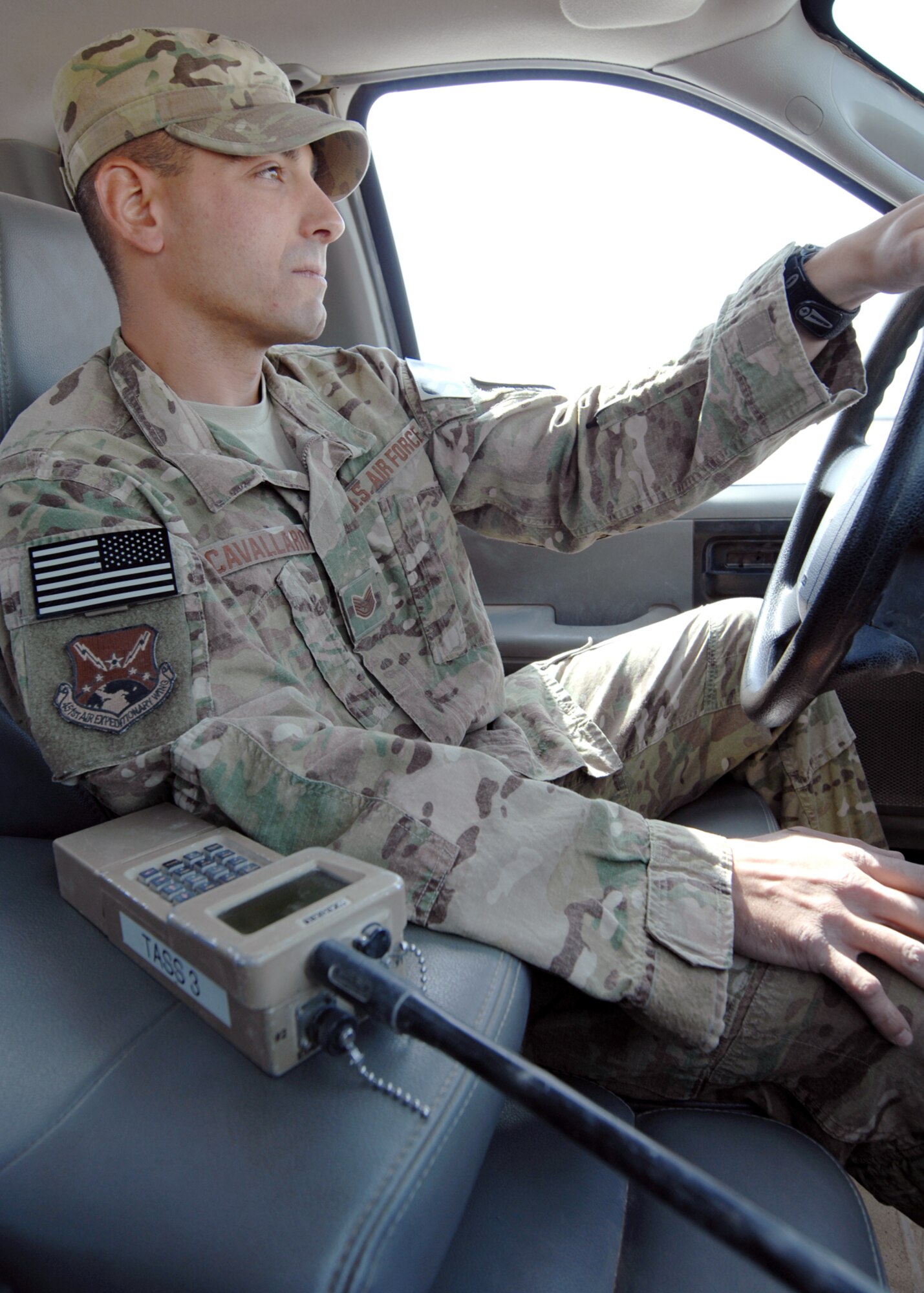 U.S. Air Force Tech Sgt. Joseph Cavallaro, 451st Expeditionary Security Forces Squadron tactical automated security system administrator, patrols the Kandahar Airfield perimeter with a handheld monitor to check the signal quality and strength of security sensors around the base. (U.S. Air Force photo/Master Sgt. Russell Martin/RELEASED)