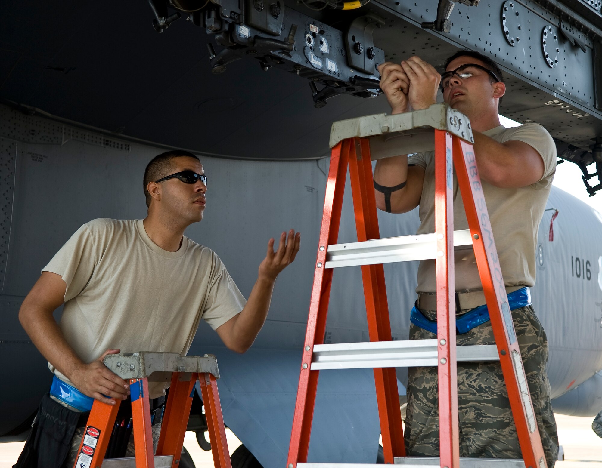 Senior Airmen Matthew Wallace and Devin Borger, 20th Aircraft Maintenance Unit Viper 1 Load Crew members, prepare a heavy storage adapter beam to hold bombs on Barksdale Air Force Base, La., Sept. 28. The bomb load was part of a competition between load crews from the 20th AMU and 96th AMU. (U.S. Air Force photo/Staff Sgt. Chad Warren)(RELEASED)