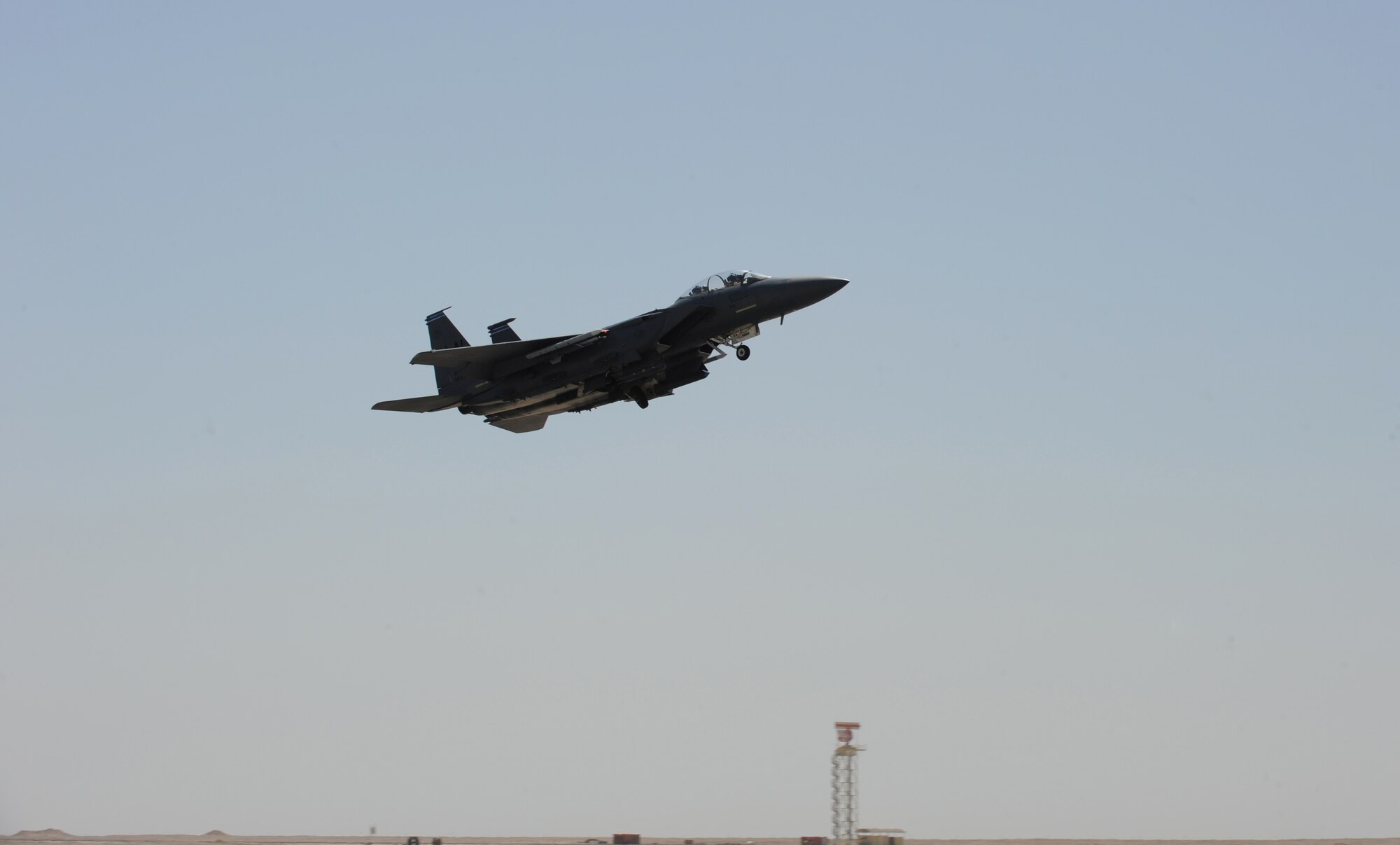 An F-15E Strike Eagle practices a touch-and-go landing maneuver at the 379th Air Expeditionary Wing, Southwest Asia, September, 26, 2012. The touch-and-go involves landing on a runway and taking off again without coming to a full stop allowing the pilot to master the landing. (U.S. Air Force photo/Staff Sgt. Sheila deVera)