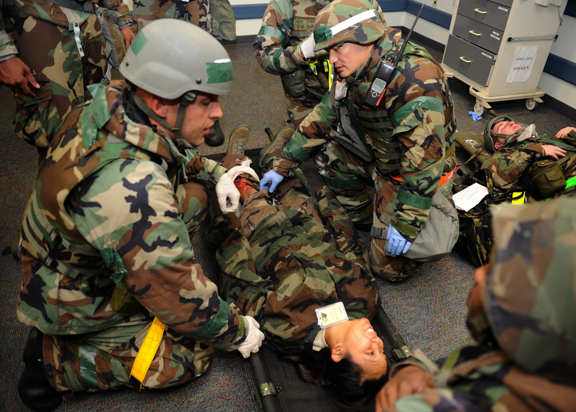 Members of the 8th Medical Operations Squadron treat a simulated broken leg following a simulated rocket attack during Exercise Beverly Midnight 12-4 on Kunsan Air Base, Republic of Korea, Sept. 27, 2012. The exercise tested the base clinic’s ability to treat wounded personnel following various types of attacks involving chemical and biological agents. (U.S. Air Force photo/Staff Sgt. Jonathan Fowler)