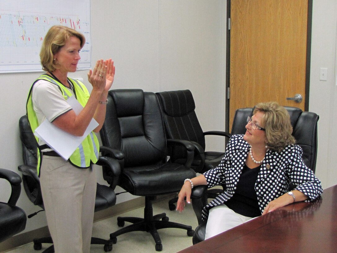 Linda Adcock (Left), Center Hill Dam Foundation Remediation Project manager, demonstrates the shape of the Center Hill reservoir to U.S. Rep Diane Black, Tennessee District 6.  Adcock discussed how the reservoir impacts the major rehabilitation of Center Hill Dam. (USACE photo by Bill Peoples)