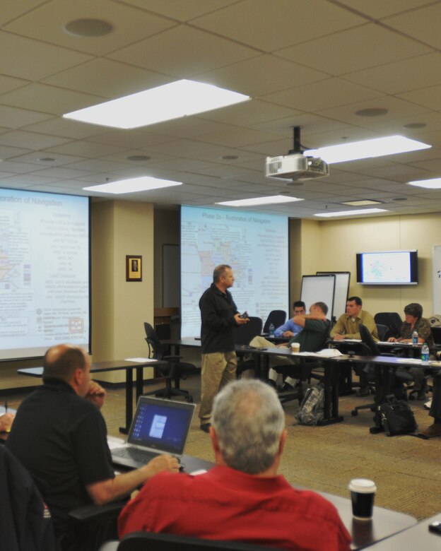 Tom Howko, regional civil planner for the Great Lakes and Ohio River Division, explains how navigation restoration is a key to an effective emergency response following an earthquake.  He spoke to responding emergency management liaisons at the New Madrid Planning Workshop. (USACE photo by Amy Redmond)