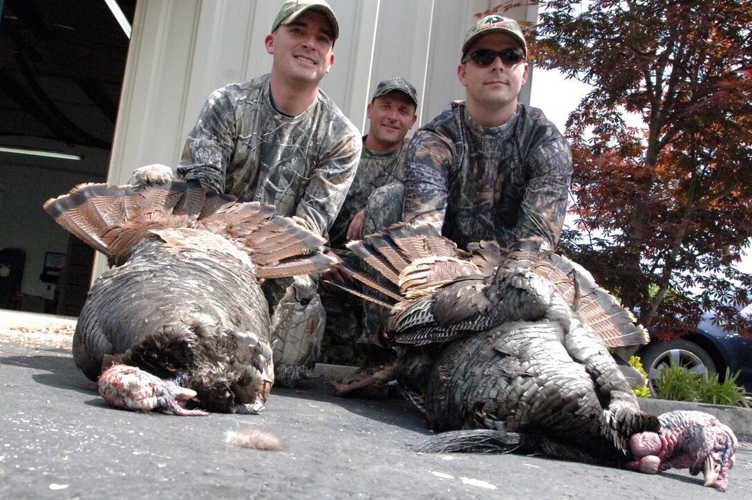 (Left to right) Staff Sgt. Joseph R. Bergen, Guide Dru Smith and Guide Brent Adcock pose with wild turkeys taken during a hunt at Center Hill Lake April 13, 2012.  The U.S. Army Corps of Engineers Nashville District organized the event that helps soldiers from Fort Campbell, Ky., in the “HOOAH” Program, which stands for “Healing Outside Of A Hospital.” (USACE photo by Lee Roberts)