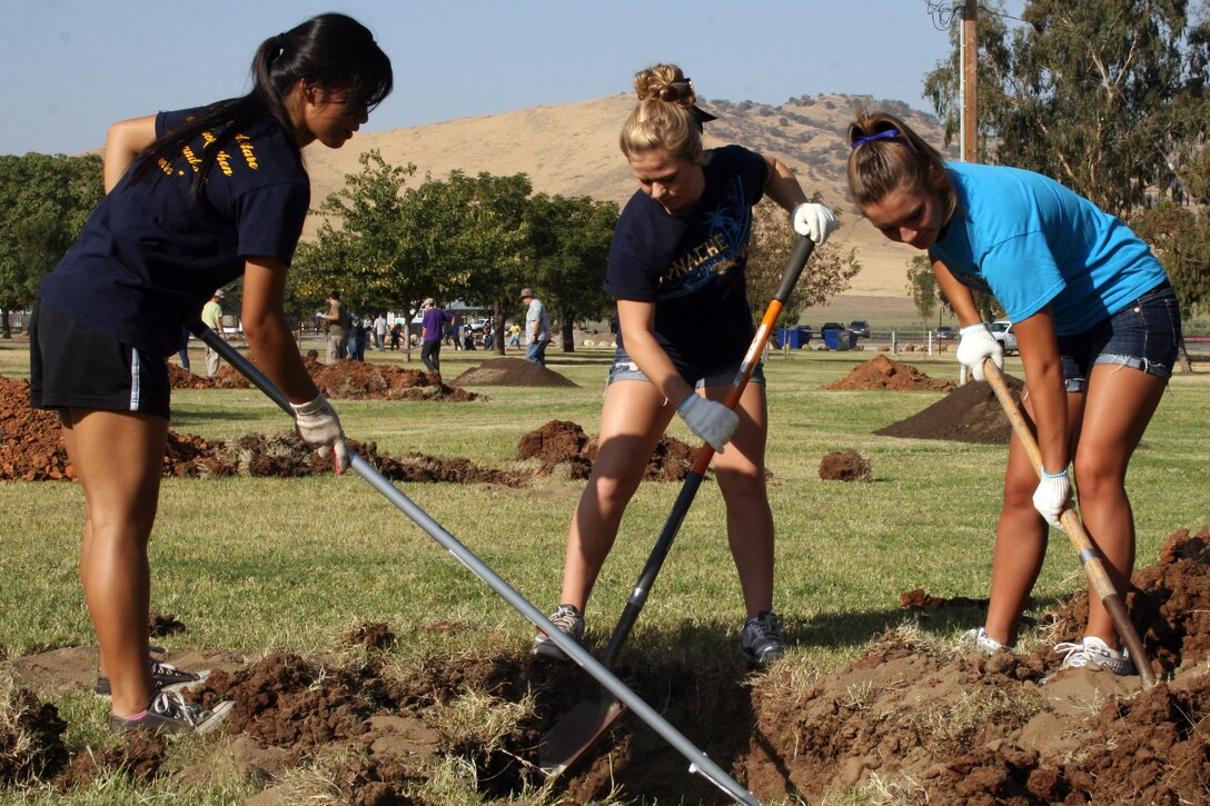 Monache High School environmental science academy students dig a hole to plant a tree at Success Lake during National Public Lands Day, Sept. 29, 2012.