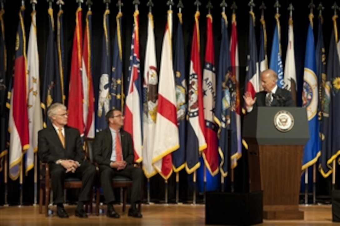 Vice President Joseph Biden speaks to Deputy Secretary of Defense Ashton Carter, center, and Executive Director of the Mine Resistant Ambush Protected Task Force Al Shaffer at a transition ceremony for the Mine Resistant Ambush Protected (MRAP) vehicles program at the Pentagon on Oct. 1, 2012.  Biden thanked Carter, Shaffer, members of the Department of Defense and private industry for their work in providing MRAP vehicles. The ceremony marks the start of the transition of the MRAP Joint Program Office from the Marine Corps to the Army and the formal establishment of an MRAP Program of Record within each service.   