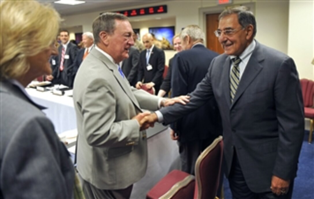 Secretary of Defense Leon E. Panetta shakes hands with members participating in the Nonprofit and Veterans Service Organizations Roundtable in the Pentagon on Oct. 1, 2012