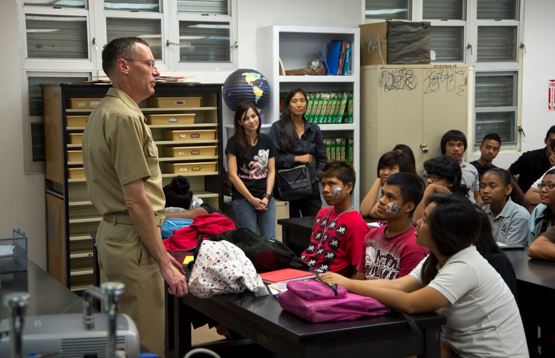 CMDR Bill Muhm, chaplain for the USS Bonhomme Richard (LHD-6) and a native of New York, New York, speaks to students of the Simon Sanchez High School during the 31st Marine Expeditionary Unit and BHR port visit here, Sept. 28. The Marines and Sailors traded their last day of liberty in Guam to visit the high school and speak about the advantages of military life and the value of an education. The 31st MEU is the only continuously forward-deployed MEU and is the Marine Corps' force in readiness in the Asia-Pacific region.