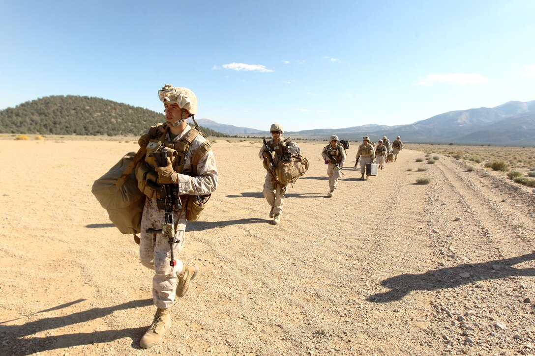 Marines with 2nd Reconnaissance Battalion load up into a KC-130 after an air raid exercise at the Sweet Water training area, Mairne Corps Mountain Warfare Training Center Bridgeport, Calif., Sept. 17, 2012.