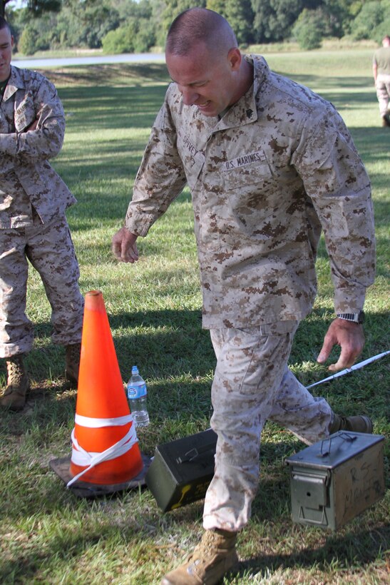 Staff Sgt Kelly Spivey, recruiter, Recruiting Substation Pensacola, Florida, completes the amo can carry portion of the maneuver under fire segment of the Combat Fitness Test September 14, 2012.