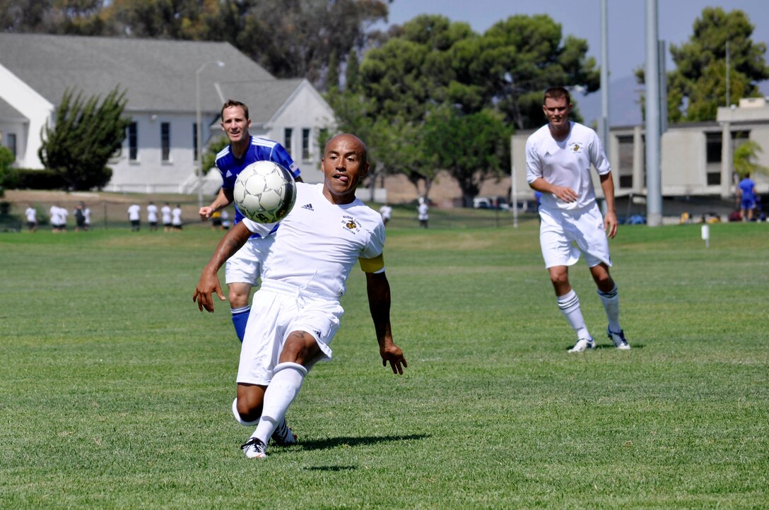Gunnery Sgt. Gabriel Jaramillo, captain of the All Marine Soccer Team and Los Angeles native, runs toward the ball during a preliminary match with the Air Force during the 2012 Armed Forces Soccer Championship here, Sept. 26. Although the Marines placed third in the competition, Jaramillo, 31, expressed that it's not about winning medals, it's about representing the Marine Corps.