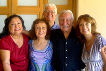 Sandra Peña Switzer (second from left), Marine Corps Systems Command’s Deputy Chief Management Officer and Department Head for the Strategic Management and Performance Department, gathers with her father and family members.