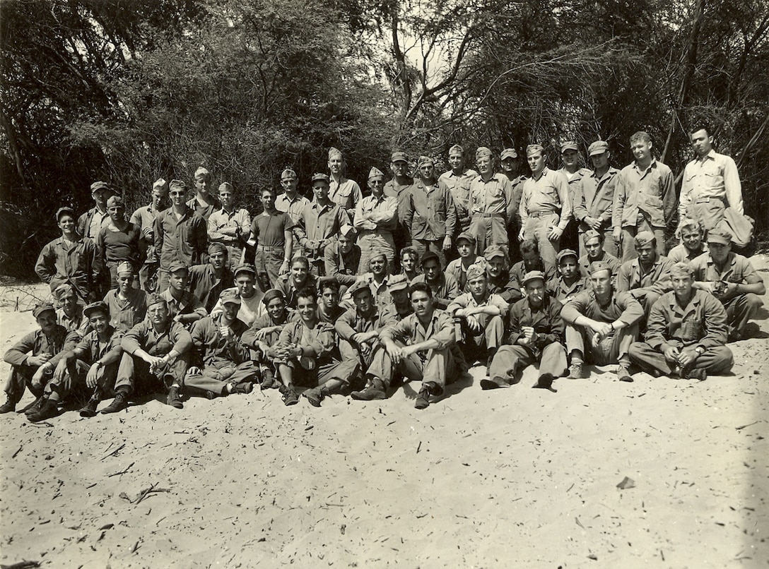 "Jim 4th from right in standing row. This is the section"