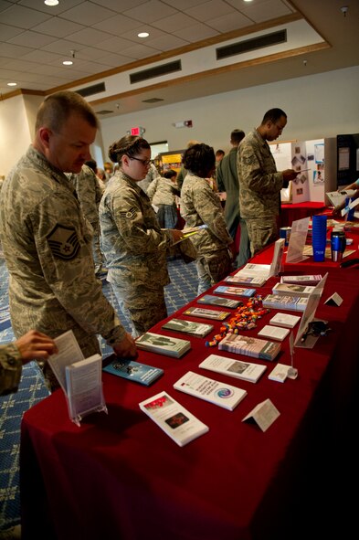 Airmen review materials for various charities that participate in the Combined Federal Campaign during the kick-off breakfast at Holloman Air Force Base, N.M., Oct. 2. A representative has been assigned to each unit at Holloman AFB, each equipped with donation booklets and cards. The unit representatives will make 100 percent contact with members in their unit to ensure that anyone who wants to donate has the opportunity to do so. (U.S. Air Force photo by Senior Airman Kasey Close/Released)