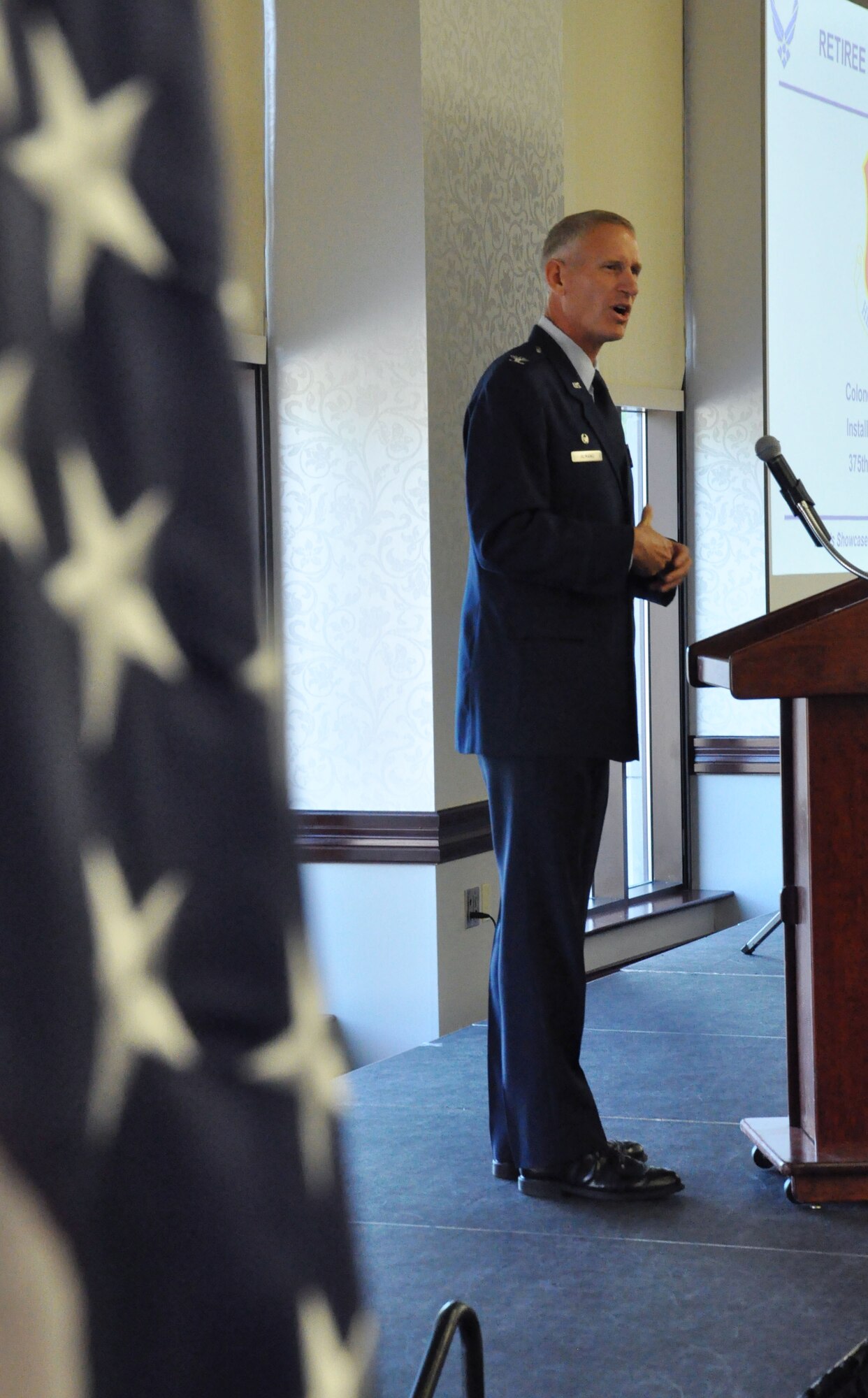 Col. David Almand, 375th Air Mobility Wing commander, gives some opening remarks for the 27th Annual Retiree Appreciation Day at the Scott Club at Scott Air Force Base, Ill. Sept. 28, 2012. The event had over 30 vendors that provided information for the retirees about their benefits while answering any questions they may have. (U.S. Air Force photo/Airman 1st Class Jake Eckhardt) 