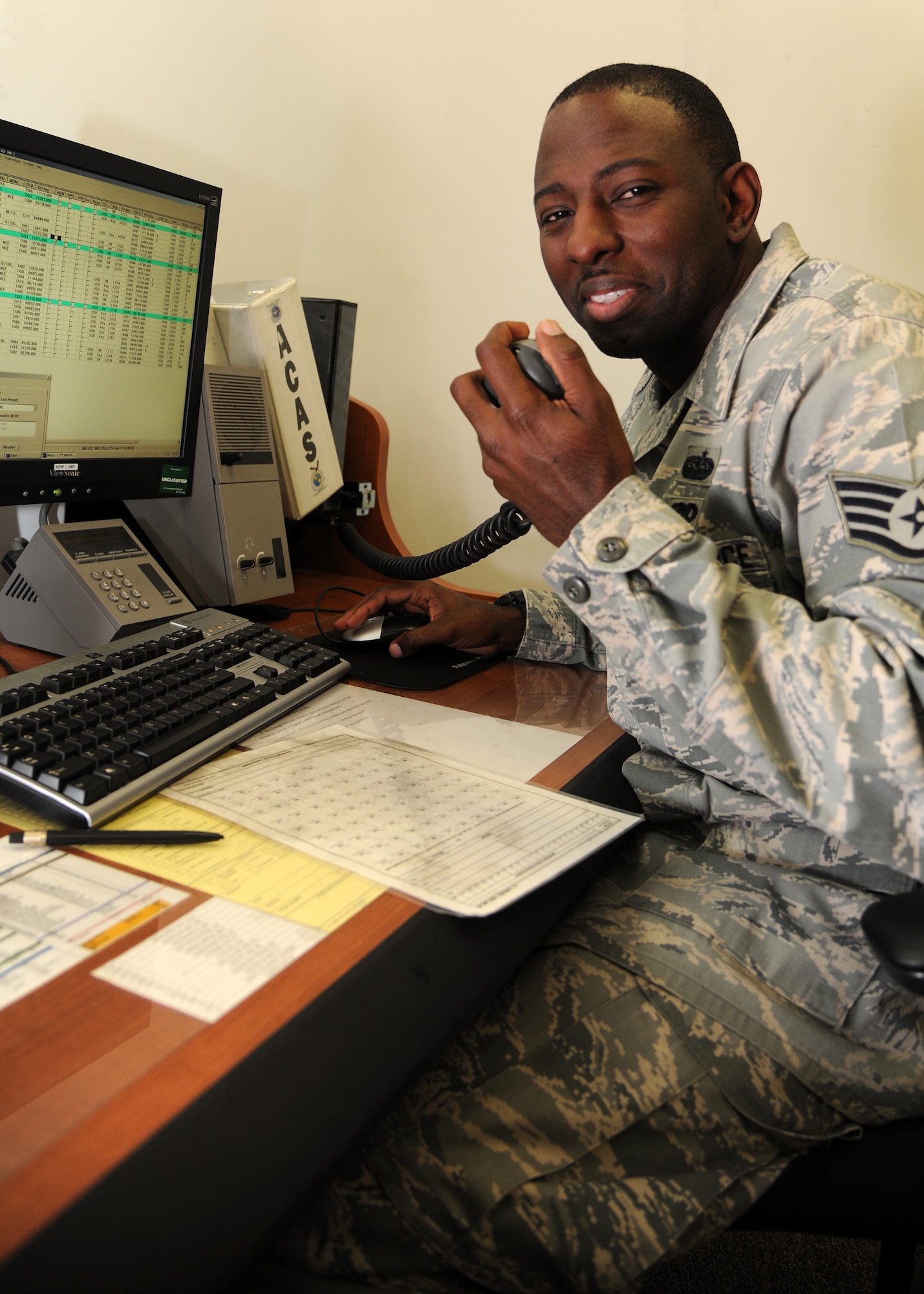 Staff Sgt. Alexander Ferguson, 319th Communications Squadron HFGCS operations supervisor, completes a radio check with an aircraft, Sept. 25, 2012, on Grand Forks Air Force Base, N. D.  Ferguson said he enjoys working with the High Frequency Global Communication System because it provides a unique opportunity to interact with different commands across the globe. (U.S. Air Force photo/Airman 1st Class Ashley N. Taylor)