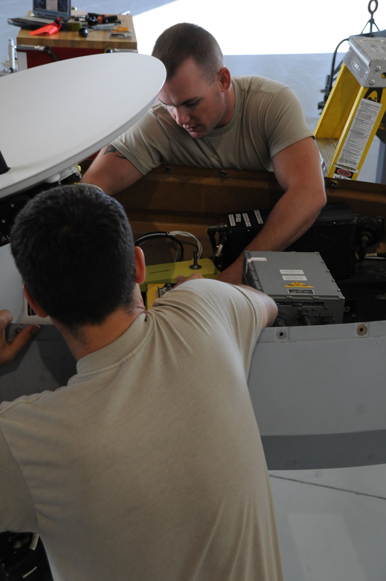 Airmen assigned to the 432d Aircraft Maintenance Squadron, adjust a ballast weight in a MQ-1 Predator remotely piloted aircraft (RPA) during the disassembling process in preparation for shipment, Creech Air Force Base, Nev., Oct. 2, 2012. Armed reconnaissance, airborne surveillance and target acquisition are the primary functions of the RPA. (U.S. Air Force photo by 432d Wing/432d Air Expeditionary Wing Public Affairs)