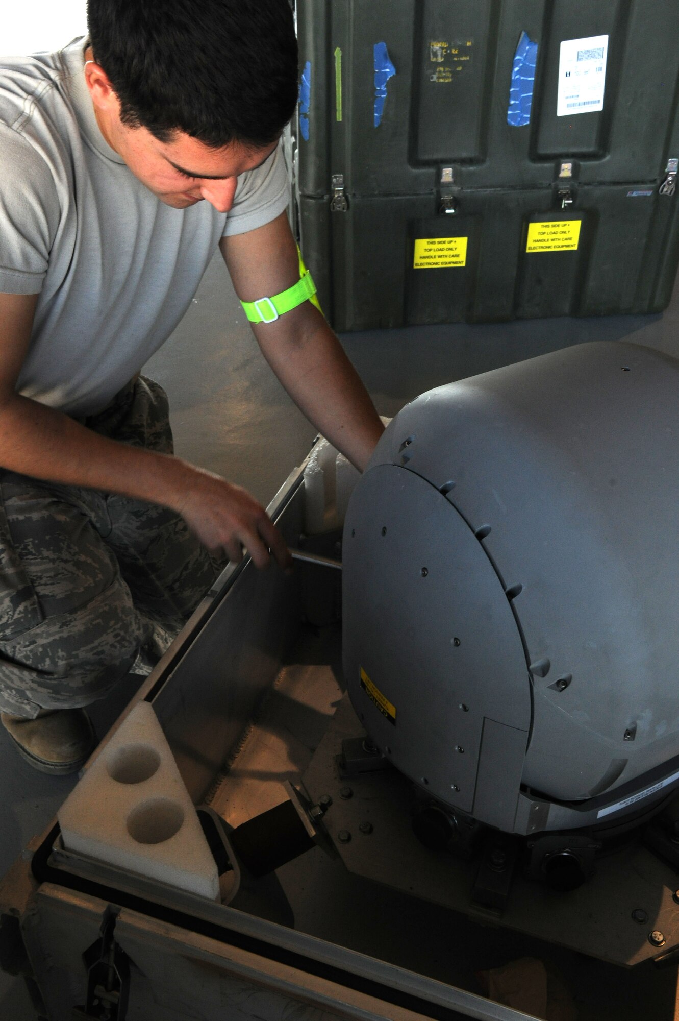 An Airman assigned to the 432d Aircraft Maintenance Squadron secures the Multi-spectral Targeting System of an MQ-1 Predator remotely piloted aircraft (RPA) into a case in preparation for shipment at Creech Air Force Base, Nev., Oct. 2, 2012. Armed reconnaissance, airborne surveillance and target acquisition are the primary functions of the RPA. (U.S. Air Force photo by 432d Wing/432d Air Expeditionary Wing Public Affairs)