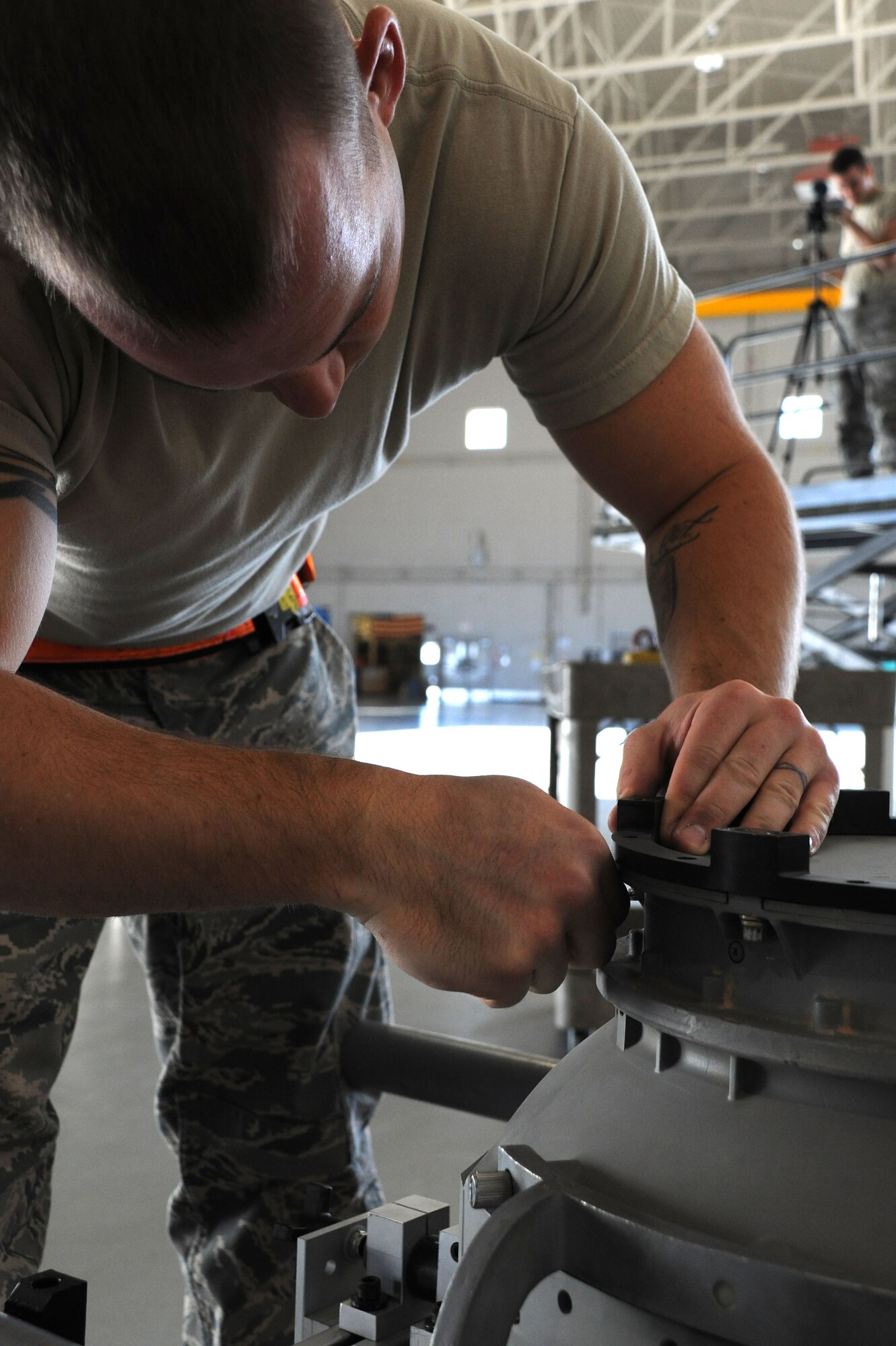An Airman assigned to the 432d Aircraft Maintenance Squadron disassembles an MQ-1 Predator remotely piloted aircraft (RPA) in preparation for shipment at Creech Air Force Base, Nev., Oct. 2, 2012. Armed reconnaissance, airborne surveillance and target acquisition are the primary functions of the RPA. (U.S. Air Force photo by 432d Wing/432d Air Expeditionary Wing Public Affairs)
