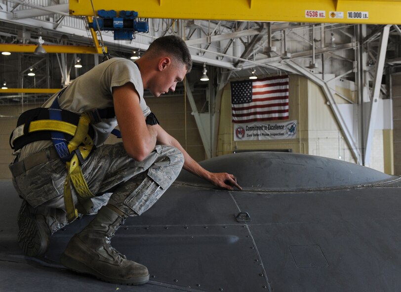Senior Airman Jacob McDonald, 2nd Maintenance Squadron phase crew chief, inspects a freshly installed B-half sealant around a Miniature Receiver Transmitter Ray-dome radar on a B-52H Stratofortress on Barksdale Air Force Base, La., Oct. 3. McDonald checked the seal to ensure it was dry and extended beyond the edges of adjoining pieces. The sealant is used to prevent leaks and corrosion. (U.S. Air Force photo/Senior Airman Micaiah Anthony)(RELEASED)