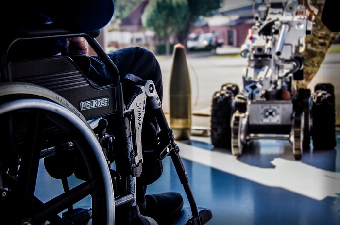 Lewis Shank, 437th Troops Carrier Group veteran, watches the Explosive Ordnance Disposal robot during a demonstration Sept. 28, 2012, at Joint Base Charleston – Air Base, S.C. The demonstration was part of a final reunion tour given to the 437th TCG. (U.S. Air Force Photo / Airman 1st Class Tom Brading)