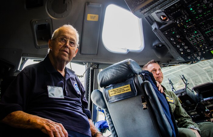 Gene Murphy, 437th Troop Carrier Group veteran, sits in the cockpit of a C-17 Globemaster III with Capt. Brent Anderson, 437th Airlift Wing deputy chief of plans. Veterans of the 437th TCG, including Murphy, toured JB Charleston – Air Base, S.C., Sept. 28, 2012. (Air Force Photo / Airman 1st Class Tom Brading)