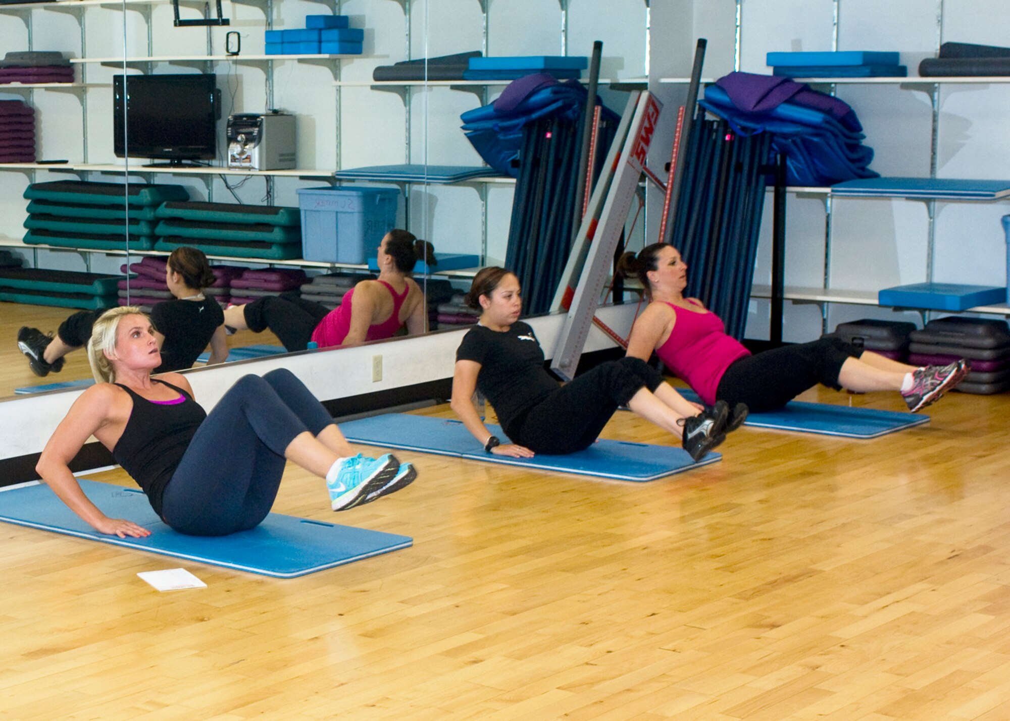 Brittney Hunsaker, 99th Medical Operations Squadron Health and Wellness Center health and fitness specialist leads an Amazing Abs class at the HAWC Oct. 1, 2012 at Nellis Air Force Base, Nev. The Amazing Abs class is one of multiple classes, which promotes better lifestyle choices by offering simpler healthy alternatives. (U.S. Air Force photo by Senior Airman Jack Sanders)
