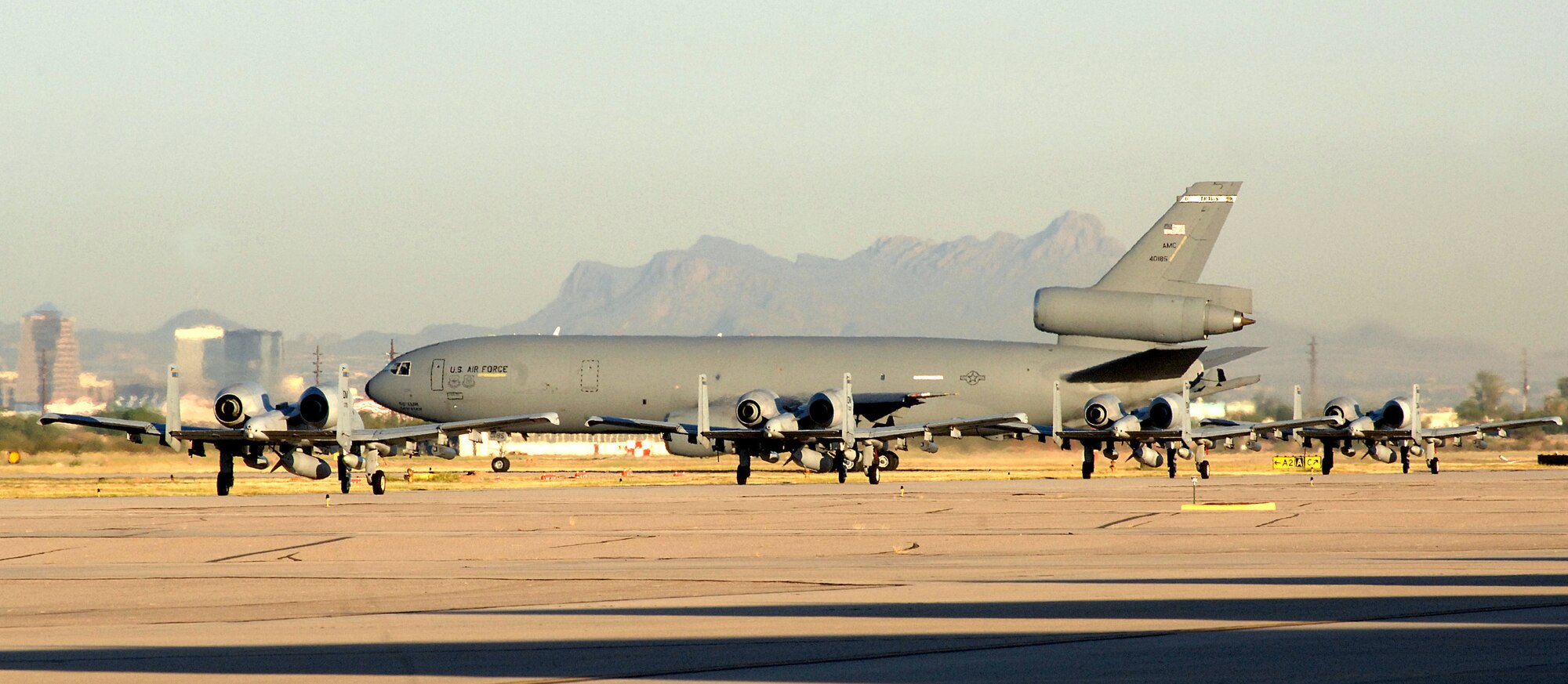 U. S. Air Force A-10 Thunderbolt II aircraft taxi down the flightline behind a KC-10 Extender as they prepare to depart on a six-month deployment to Bagram Airfield, Afghanistan in support of Operation Enduring Freedom. The 354th Fighter Squadron and 355th Aircraft Maintenance Squadron deployed more than 400 personnel and 20 aircraft to the 455th Air Expeditionary Wing in Bagram. (U. S. Air Force photo by Airman 1st Class Saphfire Cook)