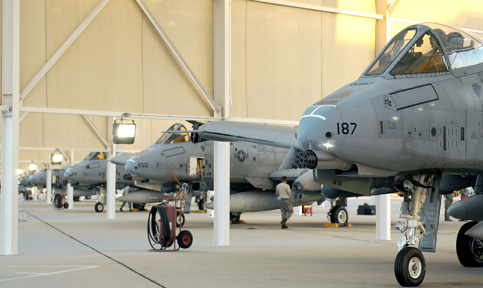U. S. Air Force A-10 Thunderbolt II aircraft sit beneath sunshades on the flightline as they are checked over before takeoff at Davis-Monthan Air Force Base, Ariz., Sept. 26, 2012. More than 20 aircraft and 400 personnel were deployed to the 455th Air Expeditionary Wing, Bagram Airfield, Afghanistan, in support of Operation Enduring Freedom. (U. S. Air Force photo by Airman 1st Class Saphfire Cook)