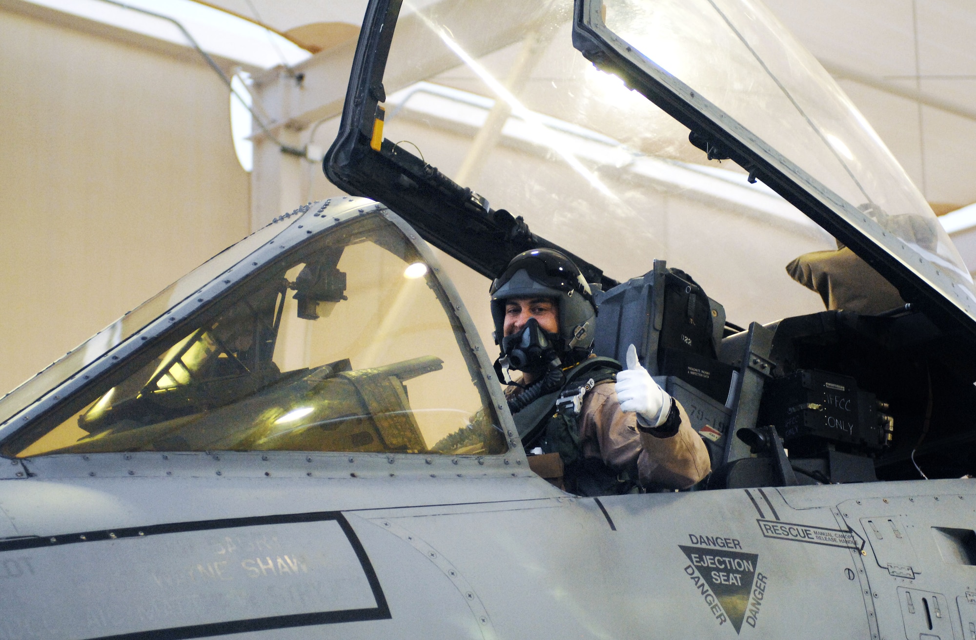 U. S. Air Force Maj. Andrew Tenenbaum, 354th Fighter Squadron takes time out from performing his preflight checks to show his enthusiasm as he prepares to depart on a six-month deployment to Bagram Airfield, Afghanistan from Davis-Monthan Air Force Base, Ariz., Sept. 26, 2012. The 354th FS, along with the 355th Aircraft Maintenance Squadron, deployed more than 400 members to Bagram in support of Operation Enduring Freedom. (U. S. Air Force photo by Airman 1st Class Saphfire Cook)