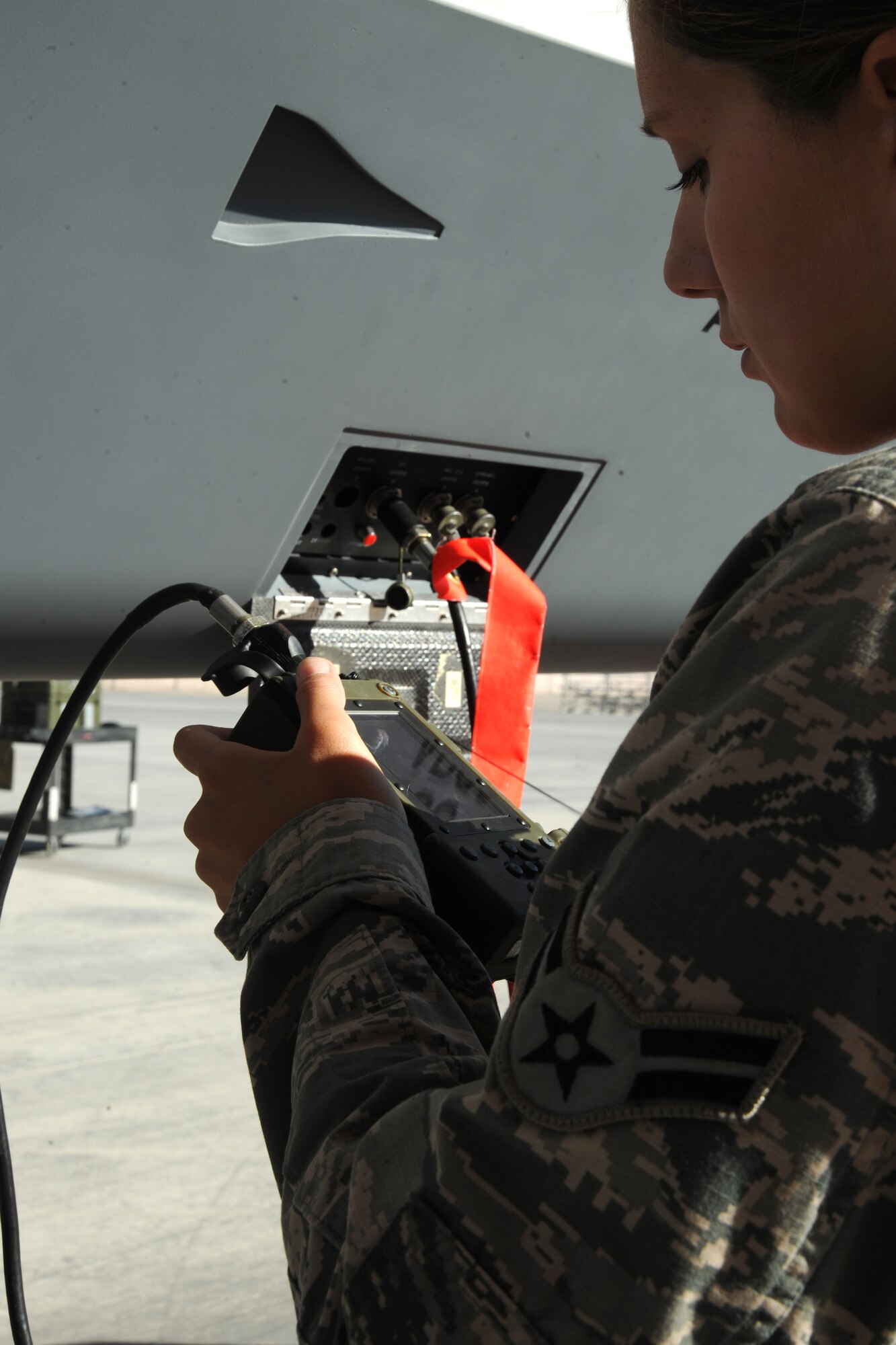 An avionics specialist with the 432d Aircraft Maintenance Squadron checks flight information for an MQ-9 Reaper during a pre-flight inspection at Creech Air Force Base, Nev., Sept. 26, 2012. An MQ-9’s primary missions are close air support, air interdiction, and intelligence, surveillance and reconnaissance. (U.S. Air Force photo by 432d Wing/432d Air Expeditionary Wing Public Affairs)