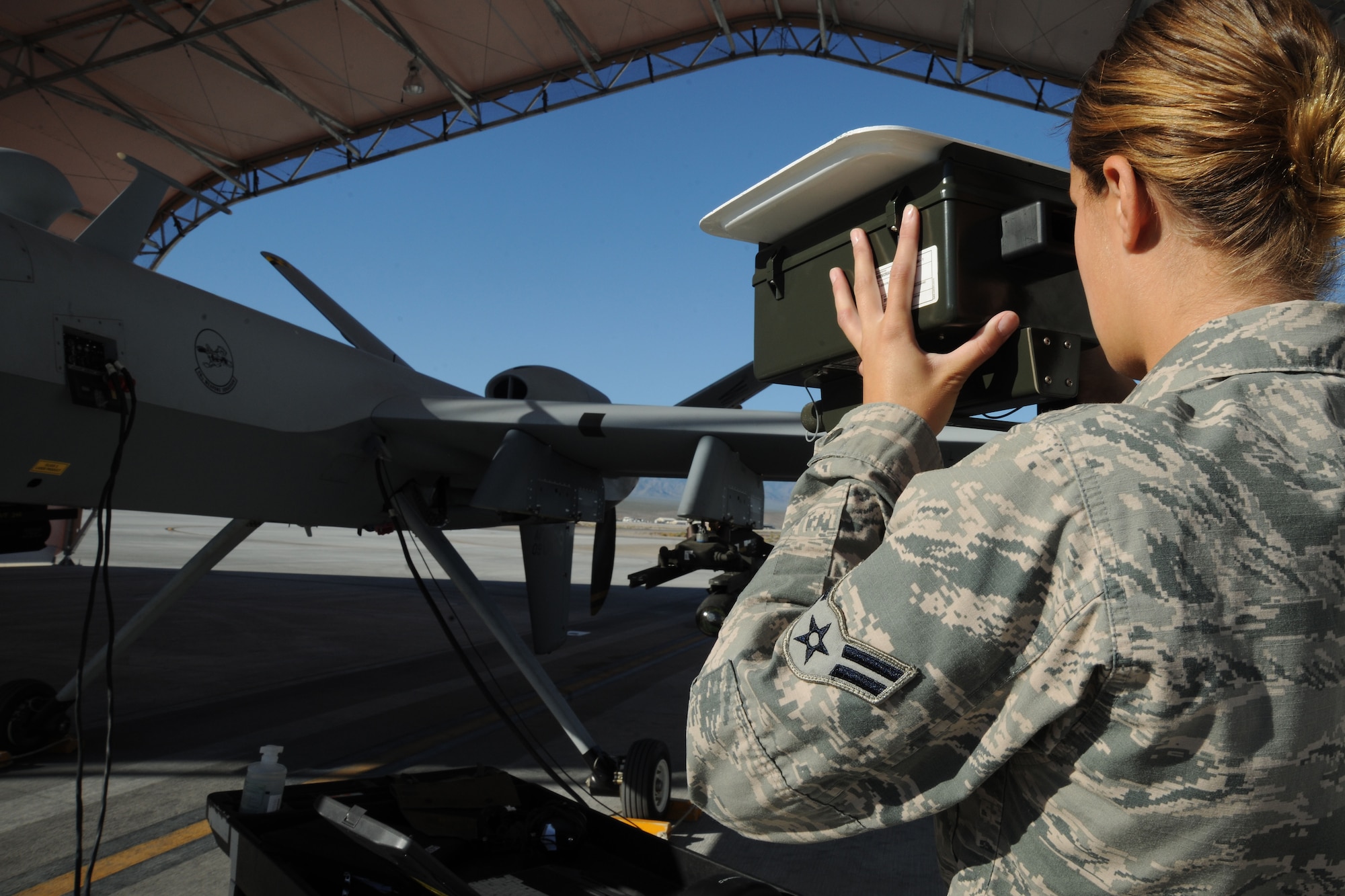 An avionics specialist with the 432d Aircraft Maintenance Squadron checks flight information for an MQ-9 Reaper during a pre-flight inspection at Creech Air Force Base, Nev., Sept. 26, 2012. An MQ-9’s primary missions are close air support, air interdiction, and intelligence, surveillance and reconnaissance. (U.S. Air Force photo by 432d Wing/432d Air Expeditionary Wing Public Affairs)
