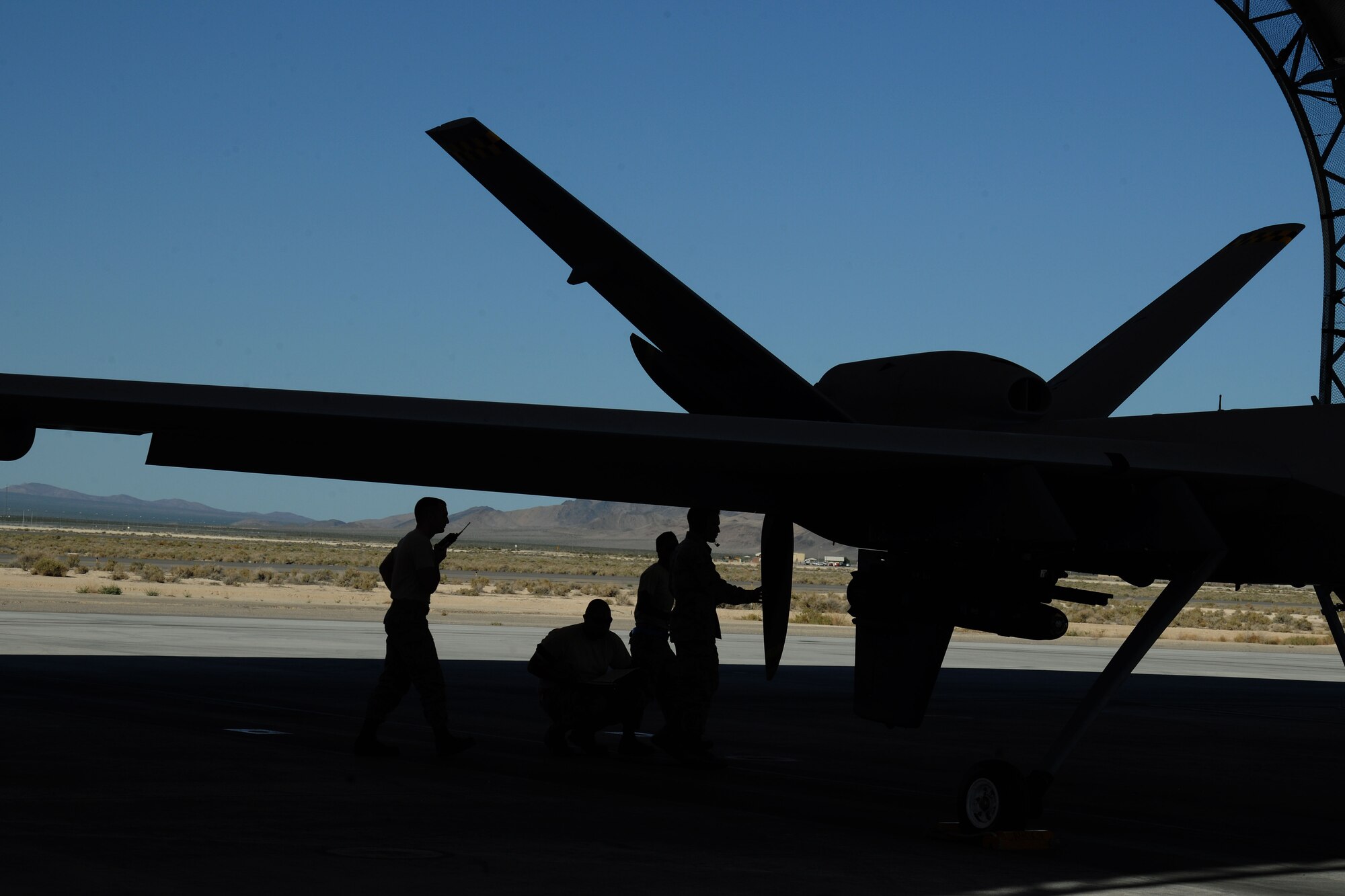 Airmen assigned to the 432d Wing/432d Air Expeditionary Wing prepare an MQ-9 Reaper remotely piloted aircraft (RPA) for a training mission by performing the required checks during a pre-flight inspection. The MQ-9 is designed to pursue time sensitive targets with persistence and precision. (U.S. Air Force photo by 432d Wing/432d Air Expeditionary Wing Public Affairs)