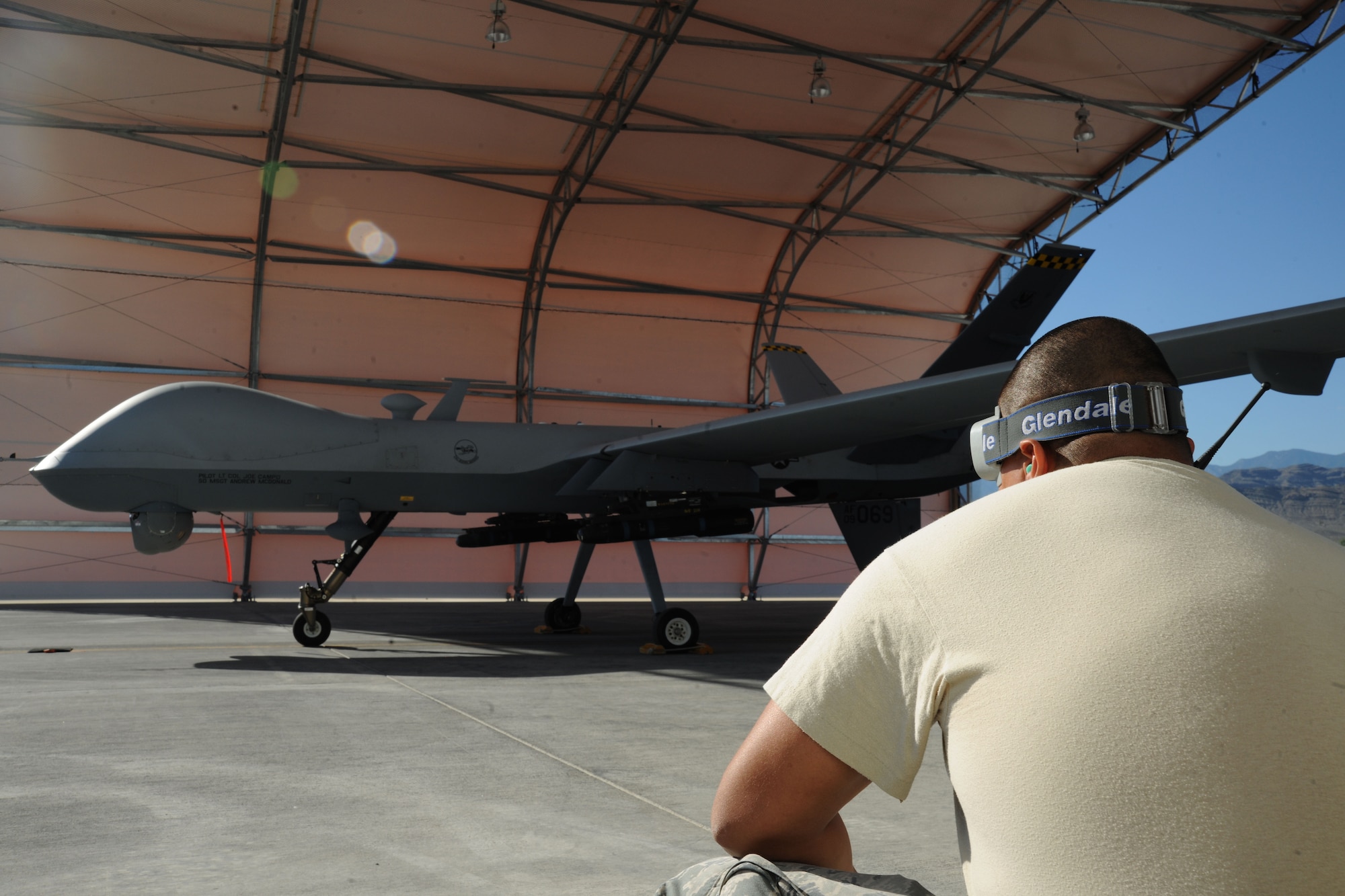 An Airman assigned to the 432d Aircraft Maintenance Squadron performs a visual inspection on an MQ-9 Reaper as it prepares to taxi during a routine training mission, Sept. 26, 2012.  An MQ-9’s primary missions are close air support, air interdiction, and intelligence, surveillance and reconnaissance. (U.S. Air Force photo by 432d Wing/432d Air Expeditionary Wing Public Affairs)