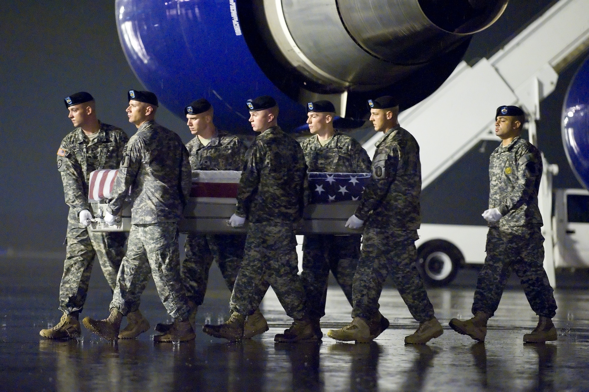 A U.S. Army carry team transfers the remains of Army Sgt. Donna R. Johnson of Raeford, N.C., at Dover Air Force Base, Del., Oct. 2, 2012. Johnson was assigned to the 514th Military Police Company, 60th Troop Command, Winterville. N.C. (U.S. Air Force photo/Adrian R. Rowan)