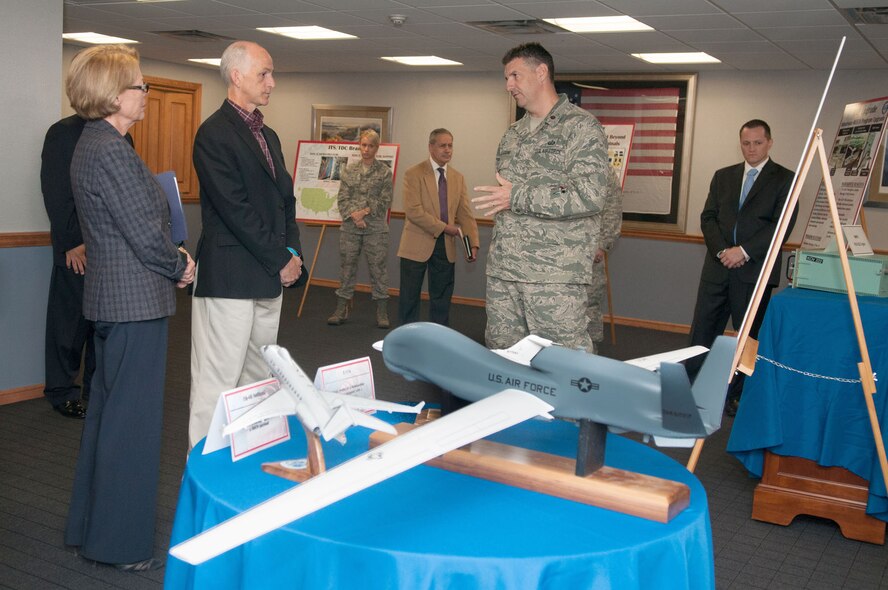 HANSCOM AIR FORCE BASE, Mass. – Maj. Nicholas Pellegrino explains the Beyond Line of Sight Command and Control Quick Reaction Capability program to House Armed Services Committee members U.S. Reps. Niki Tsongas (left) and Adam Smith during a tour of the base Sept. 26. Tsongas invited Smith here to learn more about Hanscom’s mission. (U.S. Air Force photo by Rick Berry) 