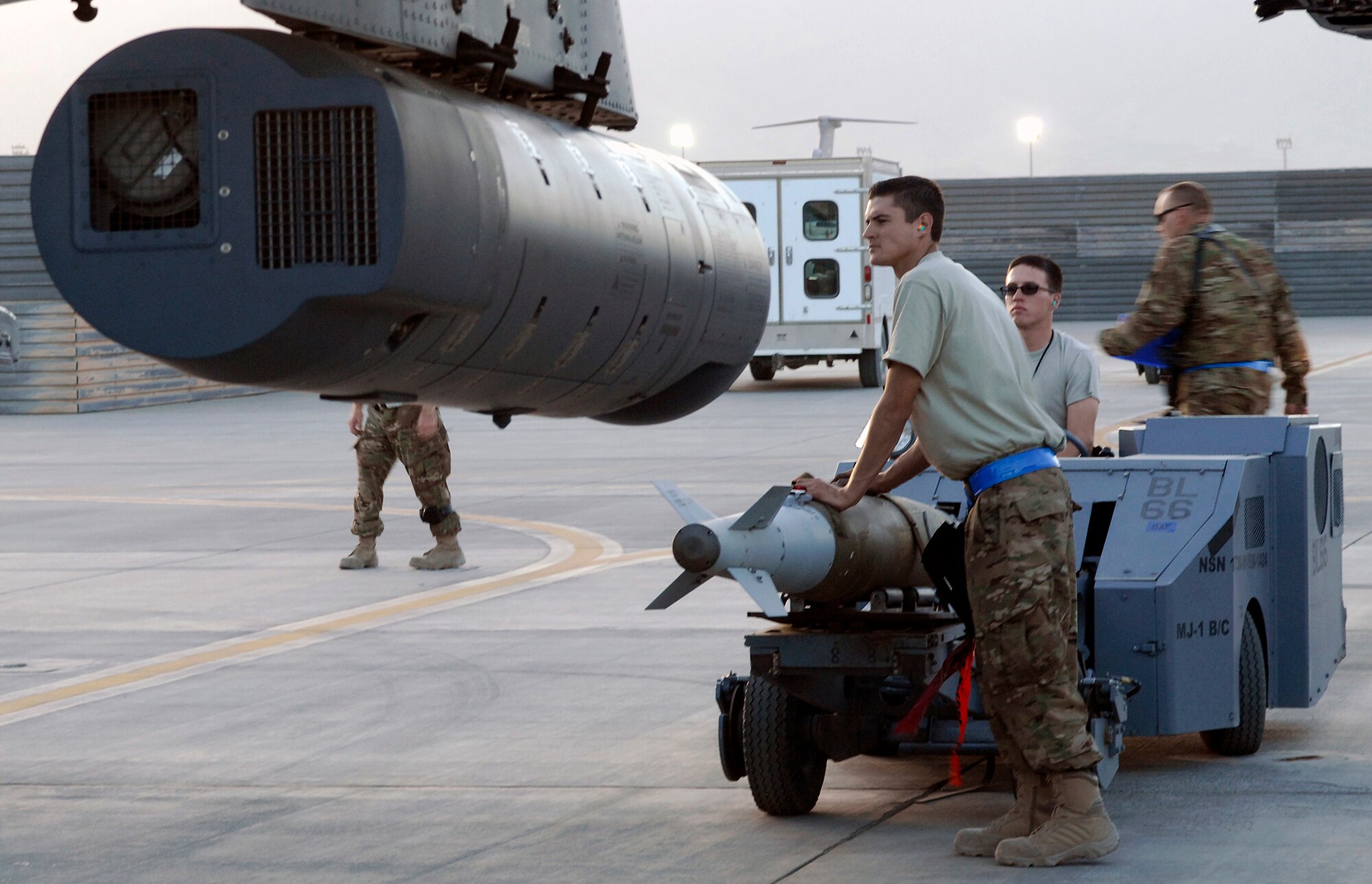 Weapon loaders from the 455th Expeditionary Aircraft Maintenance Squadron arm a newly arrived A-10 Thunderbolt IIs from Davis-Monthan Air Force Base’s 354th Fighter Squadron at Bagram Air Field, Afghanistan, Oct. 3, 2012. Affectionately called the ‘Warthog’, the A-10 is a specialized ground-attack aircraft which provides close air support to ground forces operating in Afghanistan. (U.S. Air Force Photo/Staff Sgt. Jeff Nevison)