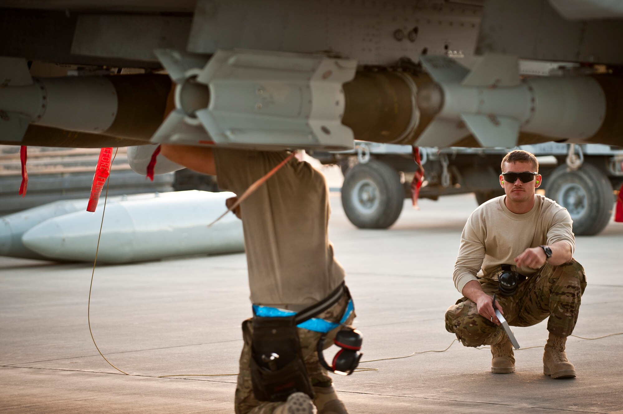 Weapon loaders from the 455th Expeditionary Aircraft Maintenance Squadron arm a newly arrived A-10 Thunderbolt IIs from Davis-Monthan Air Force Base’s 354th Fighter Squadron at Bagram Air Field, Afghanistan, Oct. 3, 2012. Affectionately called the ‘Warthog’, the A-10 is a specialized ground-attack aircraft which provides close air support to ground forces operating in Afghanistan. (U.S. Air Force Photo/Capt. Raymond Geoffroy)
