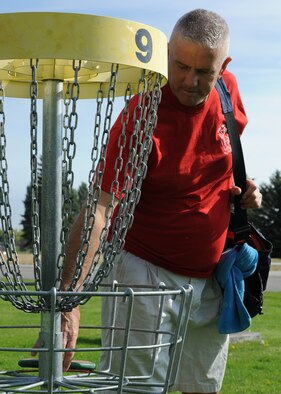 Tech. Sgt. Larry C. Kirk, 144th Maintenance Squadron aerospace ground equipment technician, throws for a birdie at the nine-hole disc golf course at Miller Park on Fairchild Air Force Base, Wash., Oct. 1, 2012. Kirk traveled more than 13,000 miles by vehicle during the period of July through Oct. (U.S. Air Force photo/Staff Sgt. Michael Means) 

